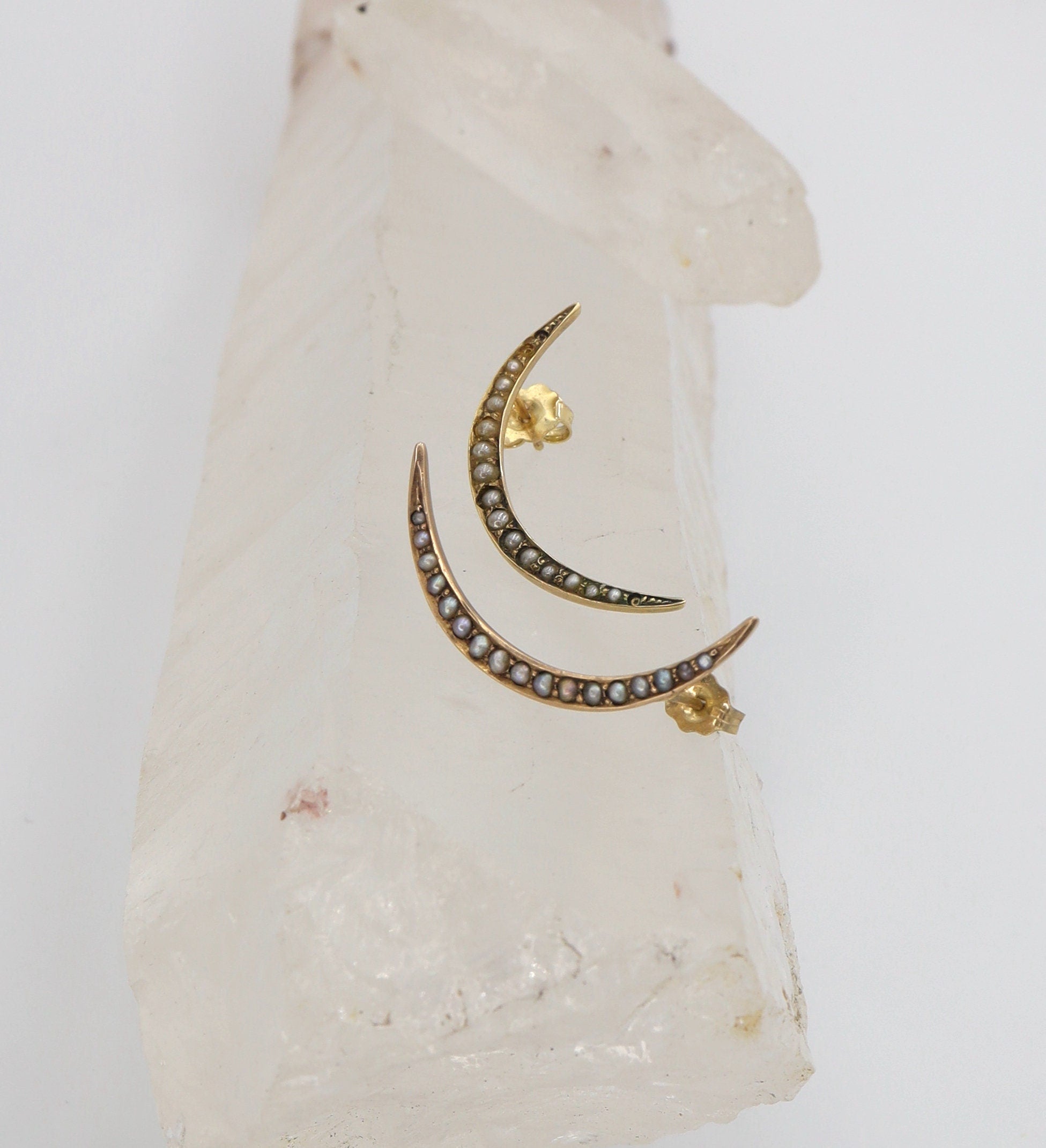 Victorian Crescent Moon Pearl Stud Earrings in 10k yellow gold featuring moon-shaped design and white pearl accents.