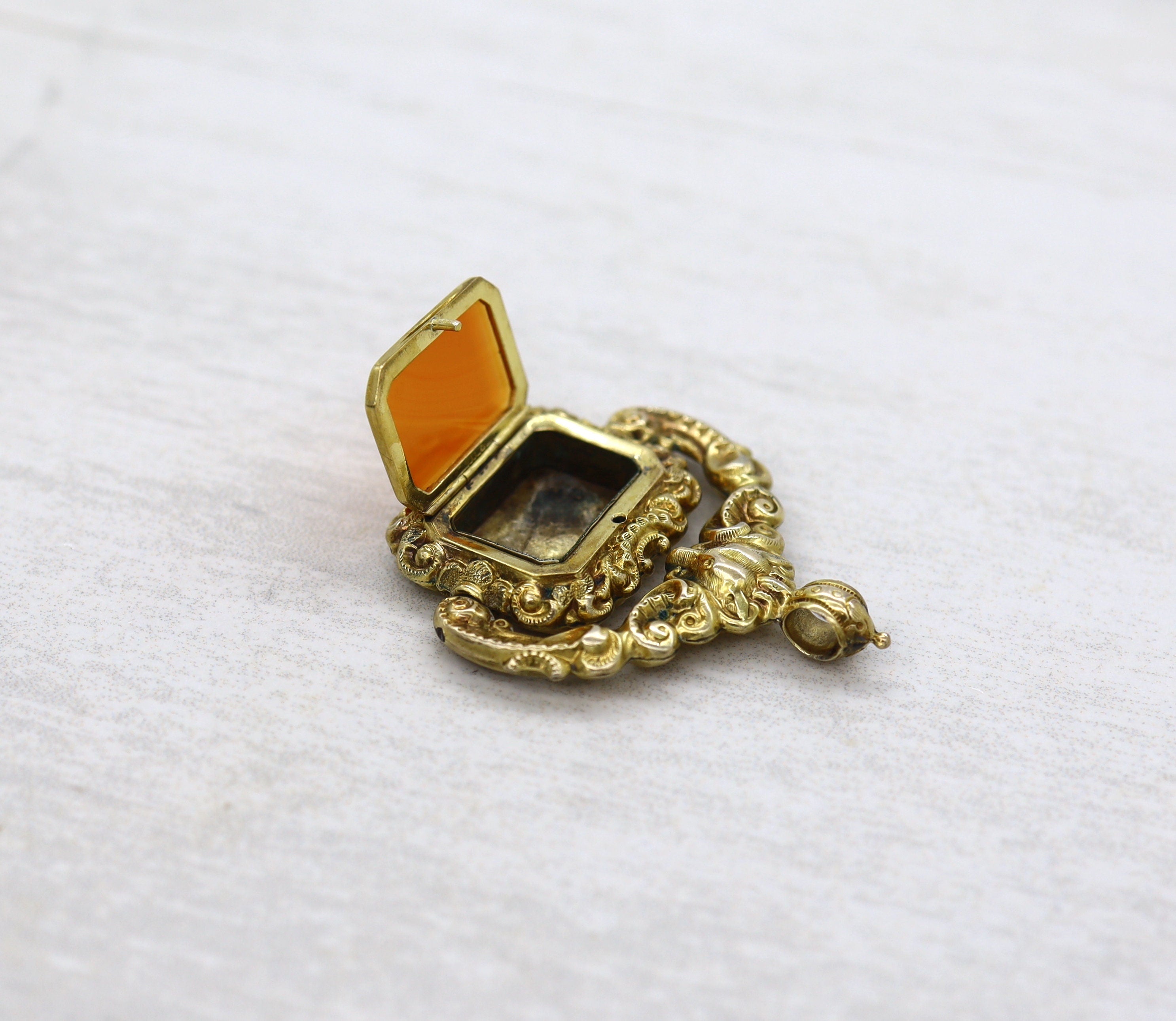 Antique Carnelian Locket Fob with Intricate Repoussé Hunting Dog Design - Petra Star