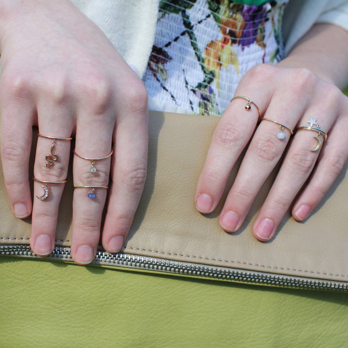 Gold stacking rings on hand model, minimalist ring collection by Petra Star in Mystic, CT.