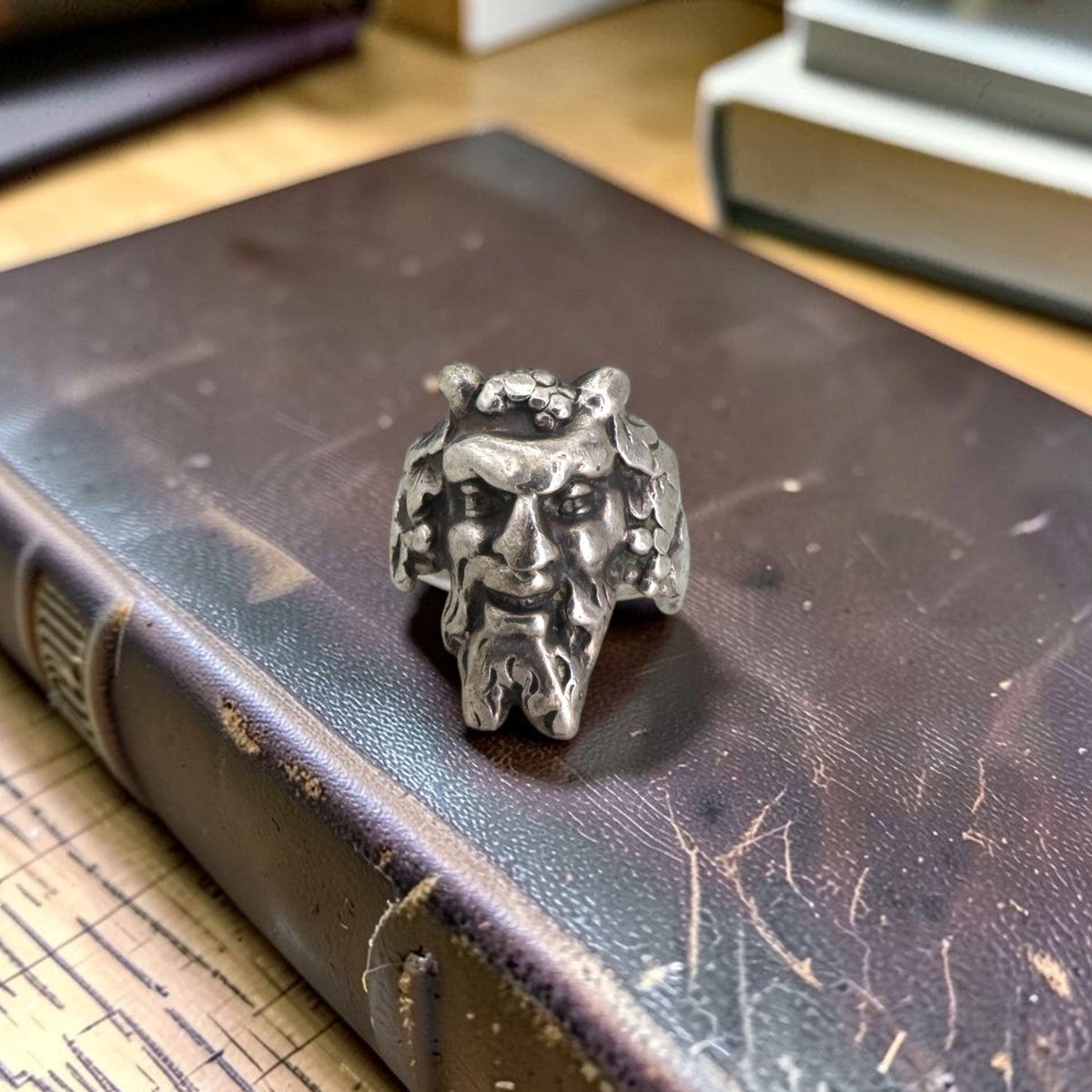 Antique silver satyr ring circa 1910, front view of horned bearded face, Petra Star