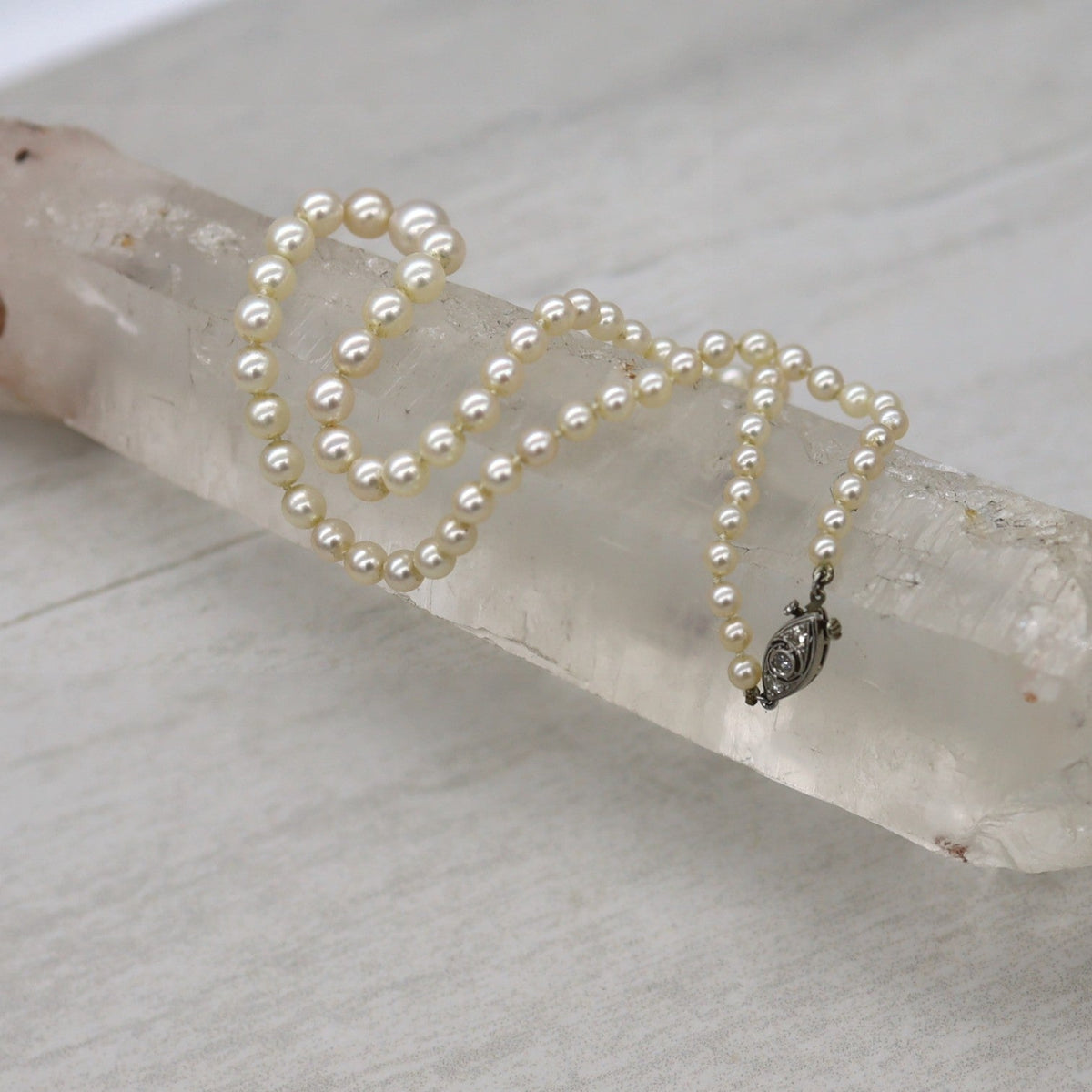 Platinum and Diamond Graduated Pearl Necklace - Petra Star