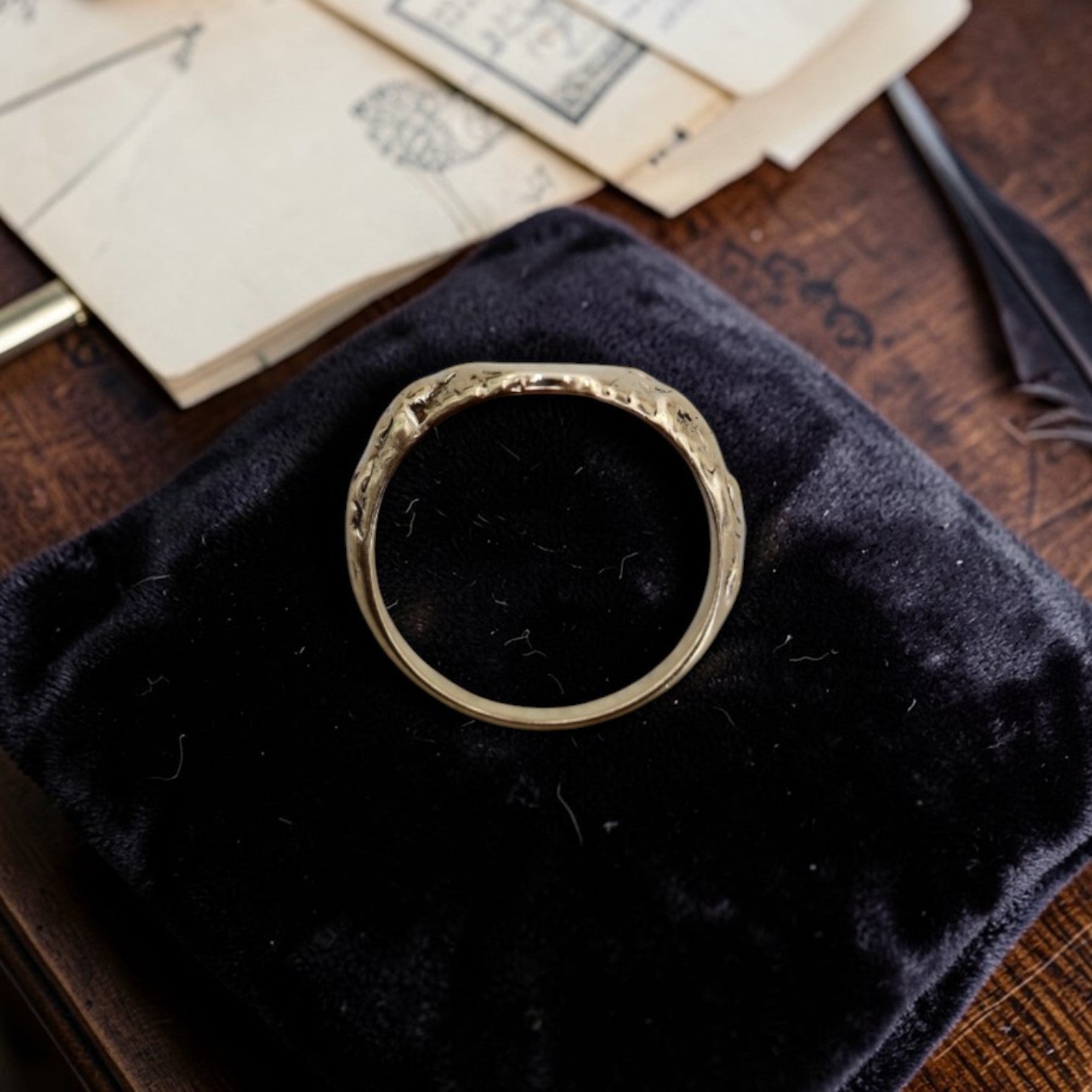 Art Nouveau signet ring in 10k yellow gold with scrollwork shoulders, showcasing intricate vintage design and customizable features.
