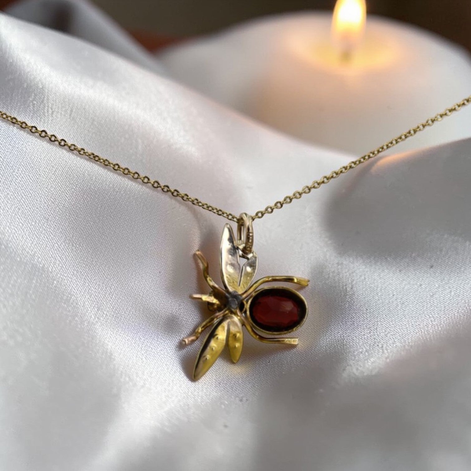 Back view of Victorian Garnet Pearl Insect Pendant showcasing intricate Victorian-style jewelry with garnet and pearl details.