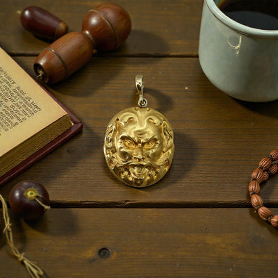 14k gold Art Nouveau lion pendant with intricate design, featuring a detailed lion face and flowing motifs, crafted by The Vintage Vault.
