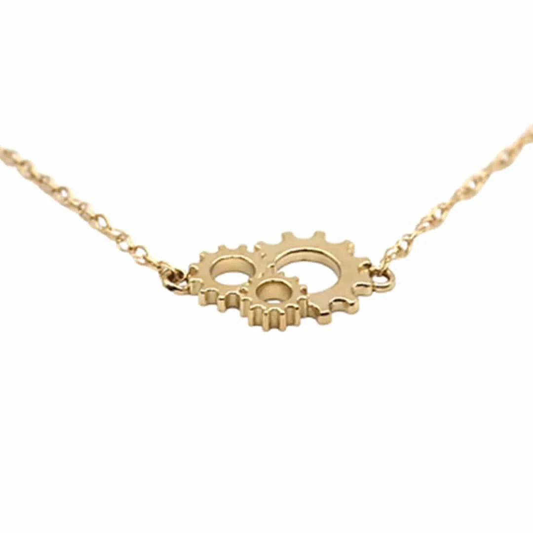 Petra Star Gearhead Necklace featuring a silver-toned metal gear pendant on a delicate chain, stylish and unique accessory.