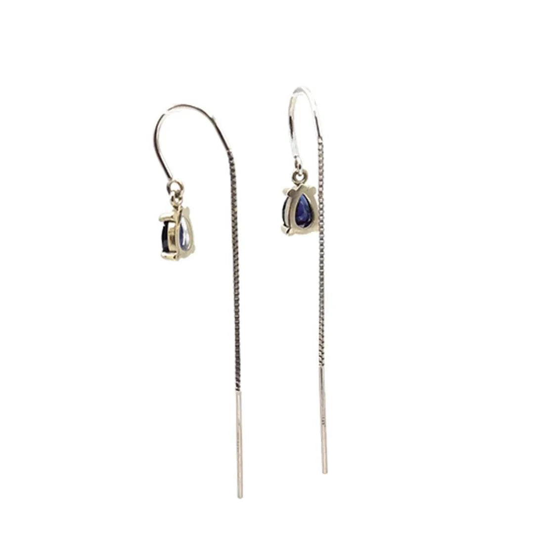 Sapphire threader earrings in 14k white gold with delicate sapphire stones, designed by Petra Star for elegant jewelry.