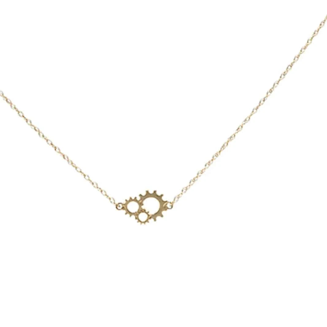 Close-up of Petra Star Gearhead Necklace featuring a detailed metallic gear pendant on a delicate chain.