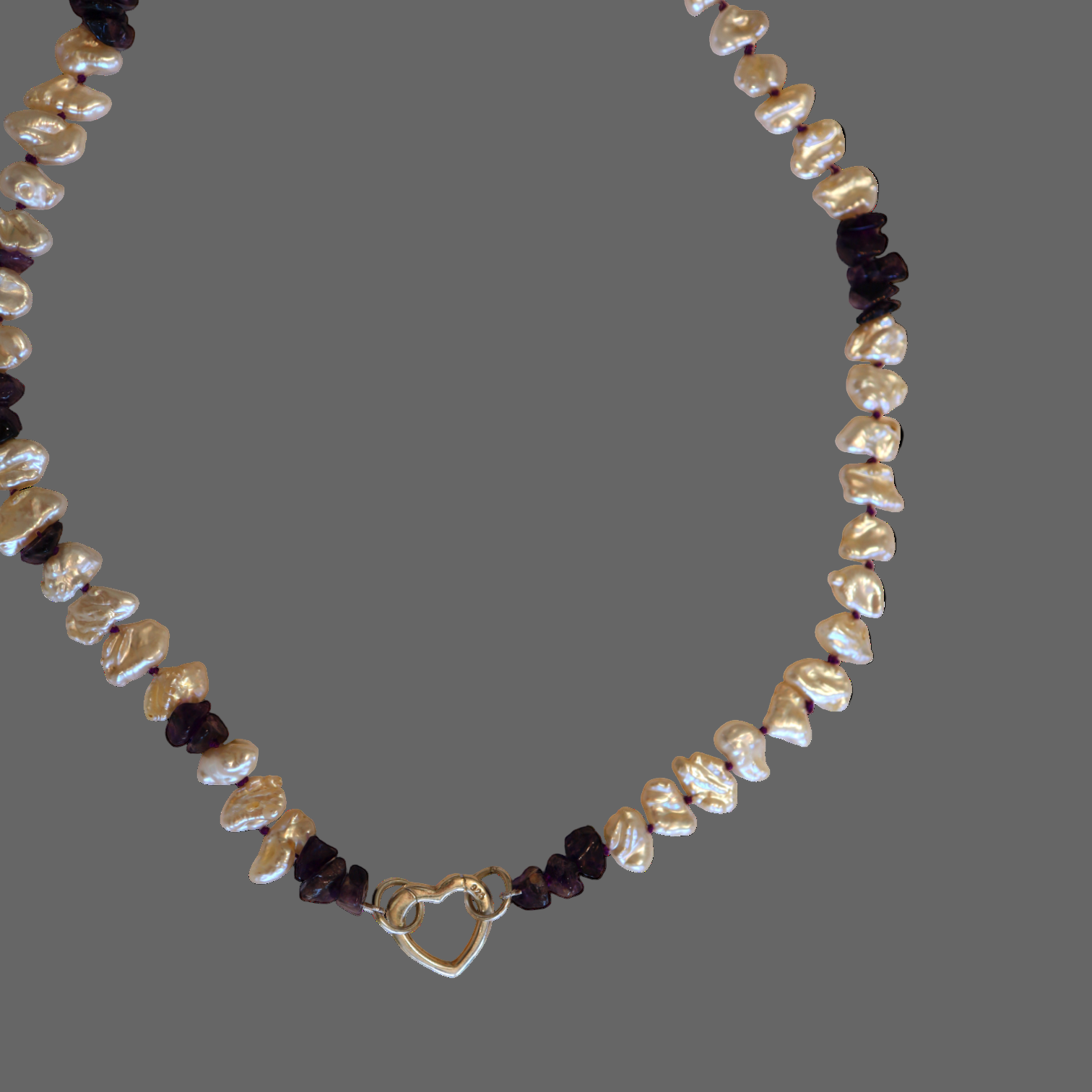 Amethyst and Keshi pearl necklace with silver heart charm holder clasp, showcasing elegant jewelry design by Petra Star.