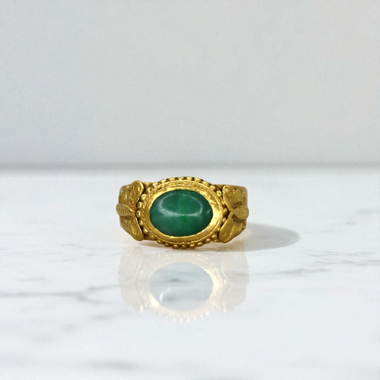 Antique Chinese jade saddle ring with butterfly design, 22K gold accents, vintage Art Nouveau style, detailed craftsmanship.