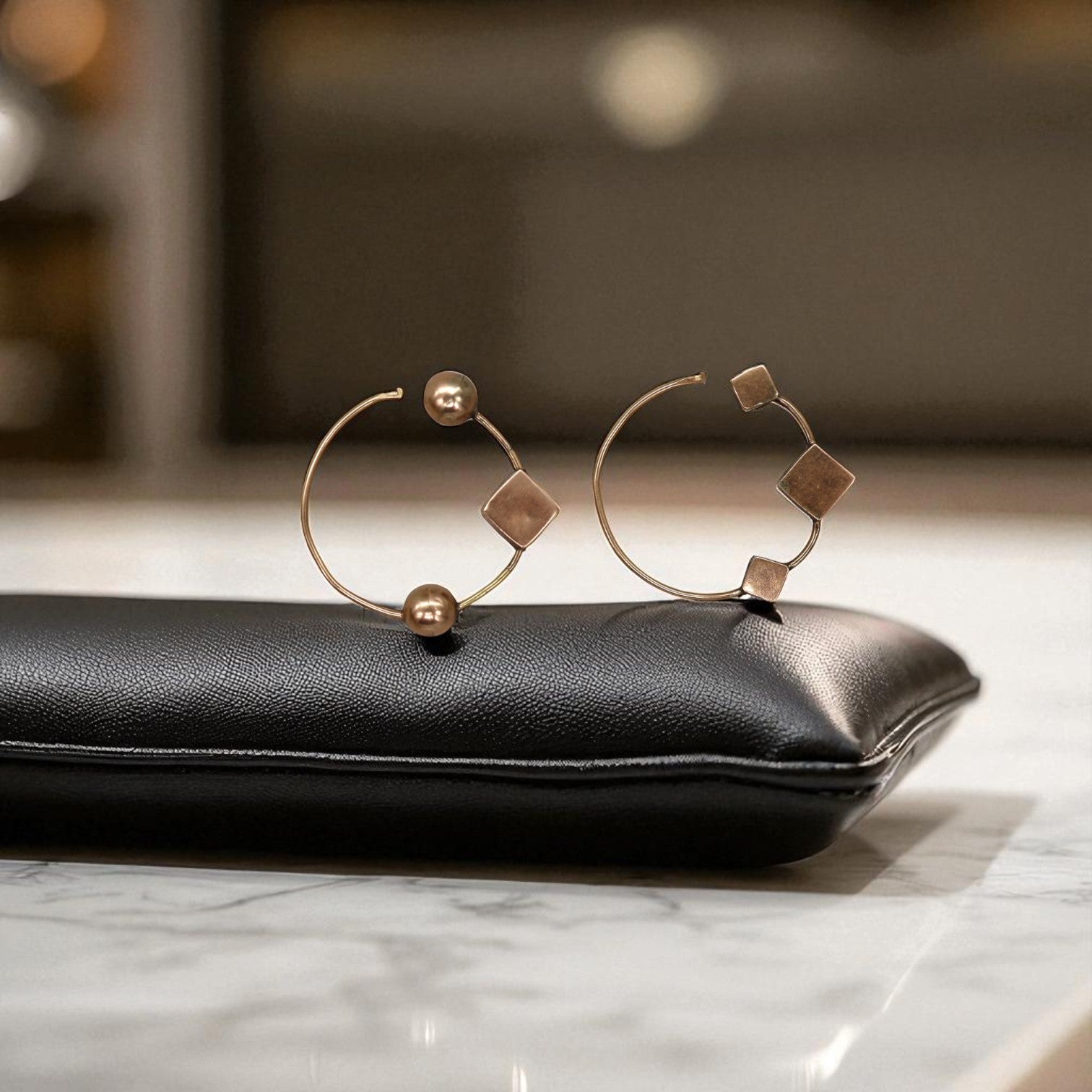 Handmade Victorian mismatched 10k pink gold hoop earrings with antique, vintage-inspired design and intricate detailing.