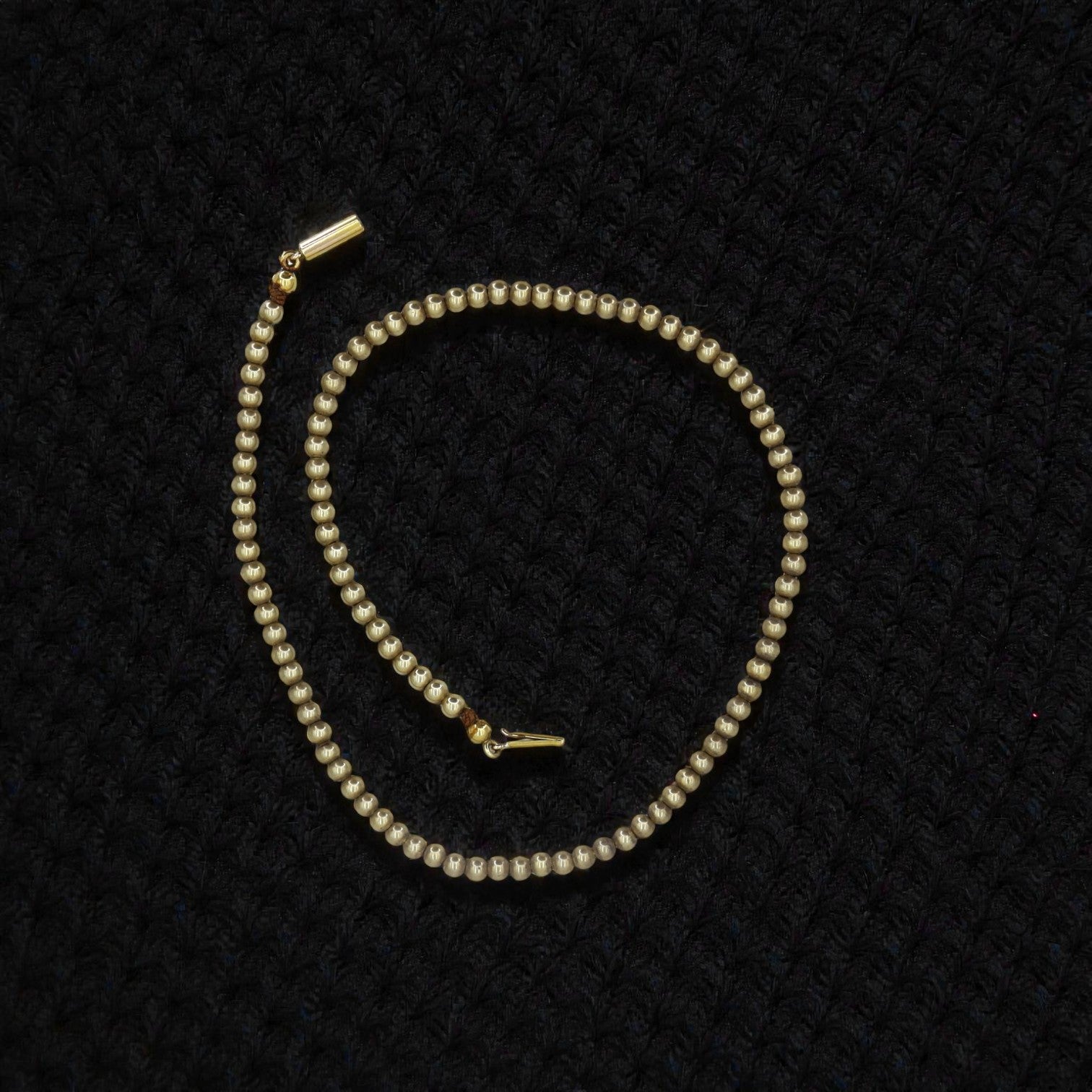 Antique gold-filled bead choker necklace featuring vintage-style beads, elegant and stylish jewelry accessory.