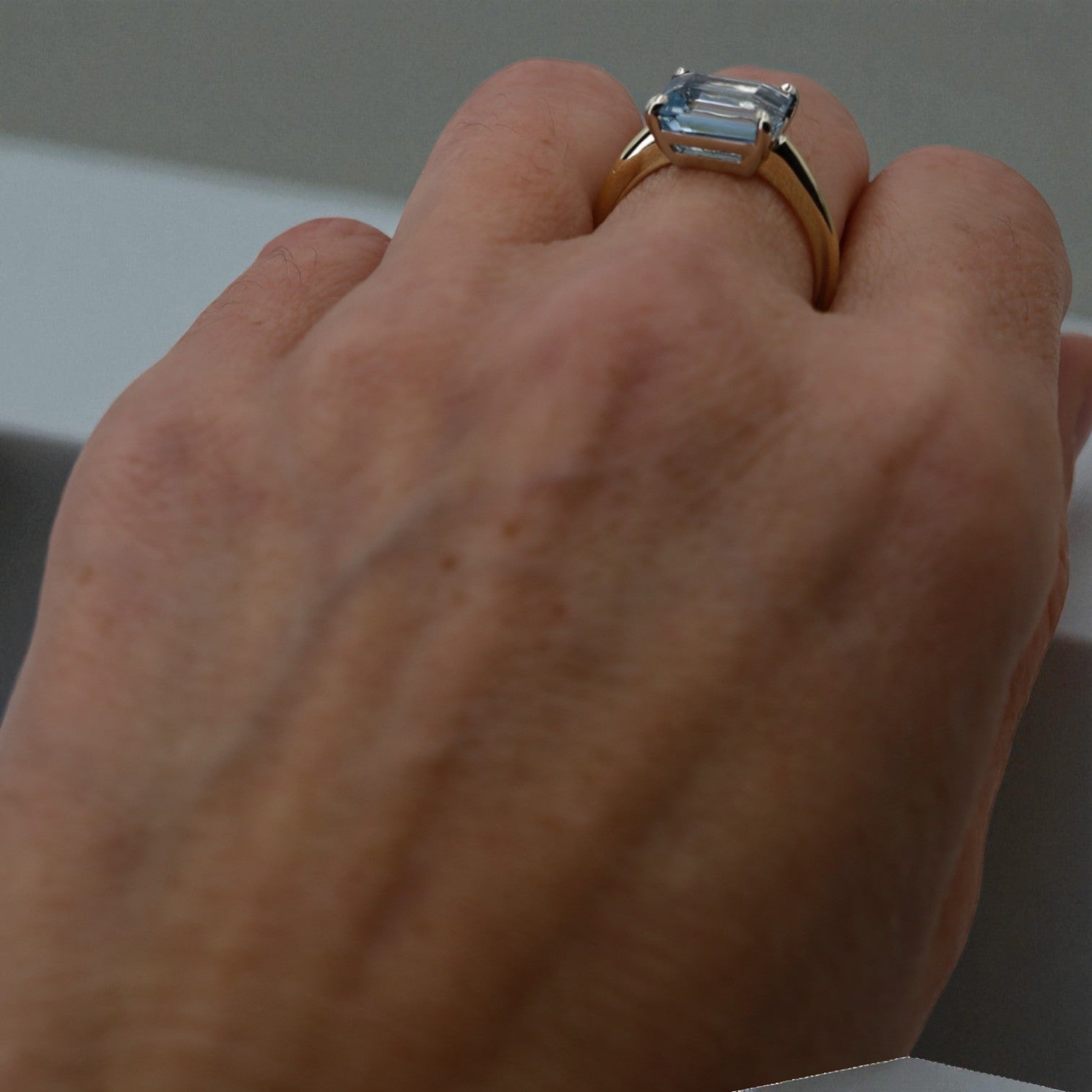 Aquamarine Emerald-Cut Solitaire in 14k Gold East-to-West Setting - Petra Star