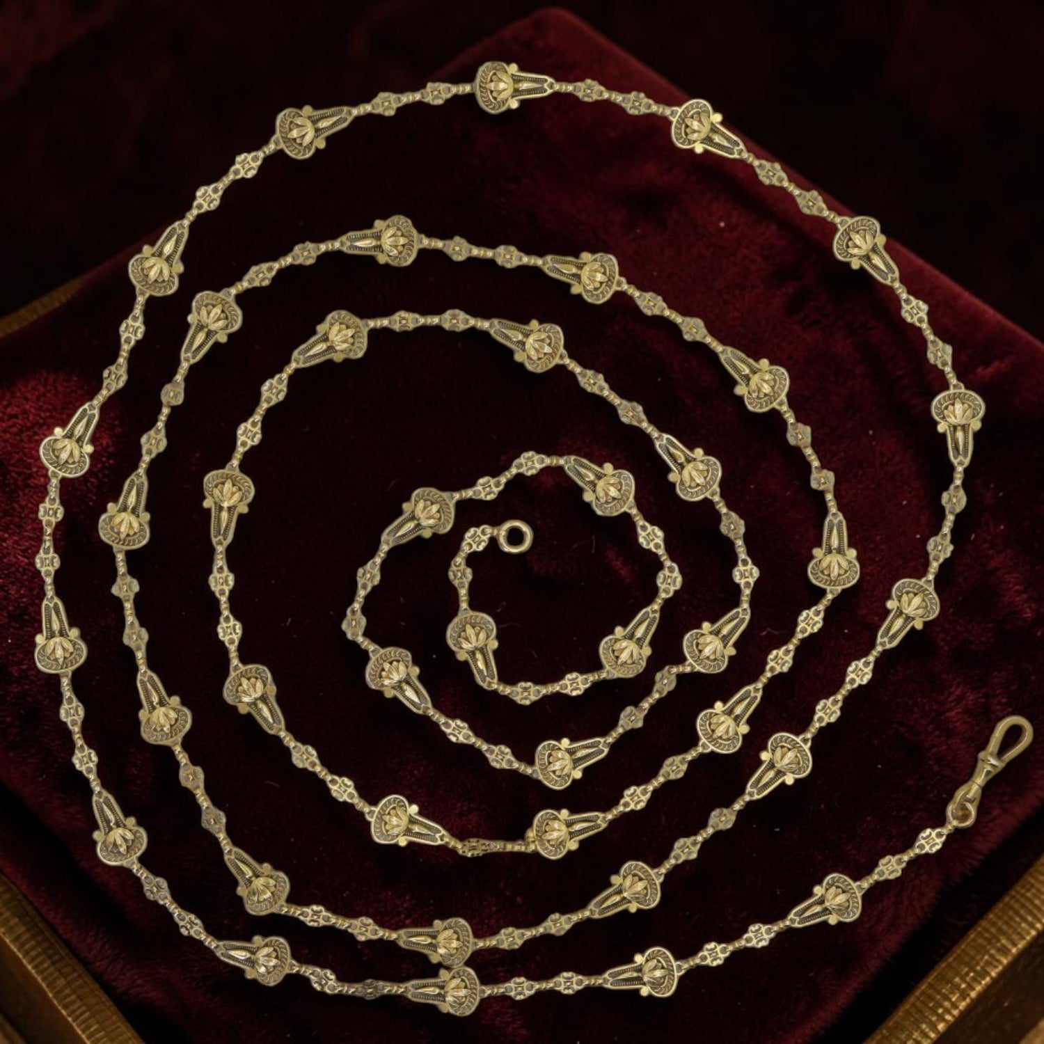 Antique 18k gold muff chain with Art Nouveau style, 65-inch long guard necklace featuring filigree drop links and vintage hallmarks.