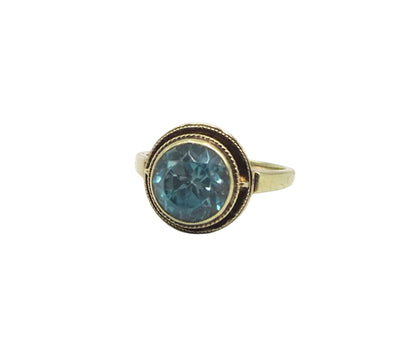 Anillo Art Decó con circonita azul en oro amarillo de 14 k