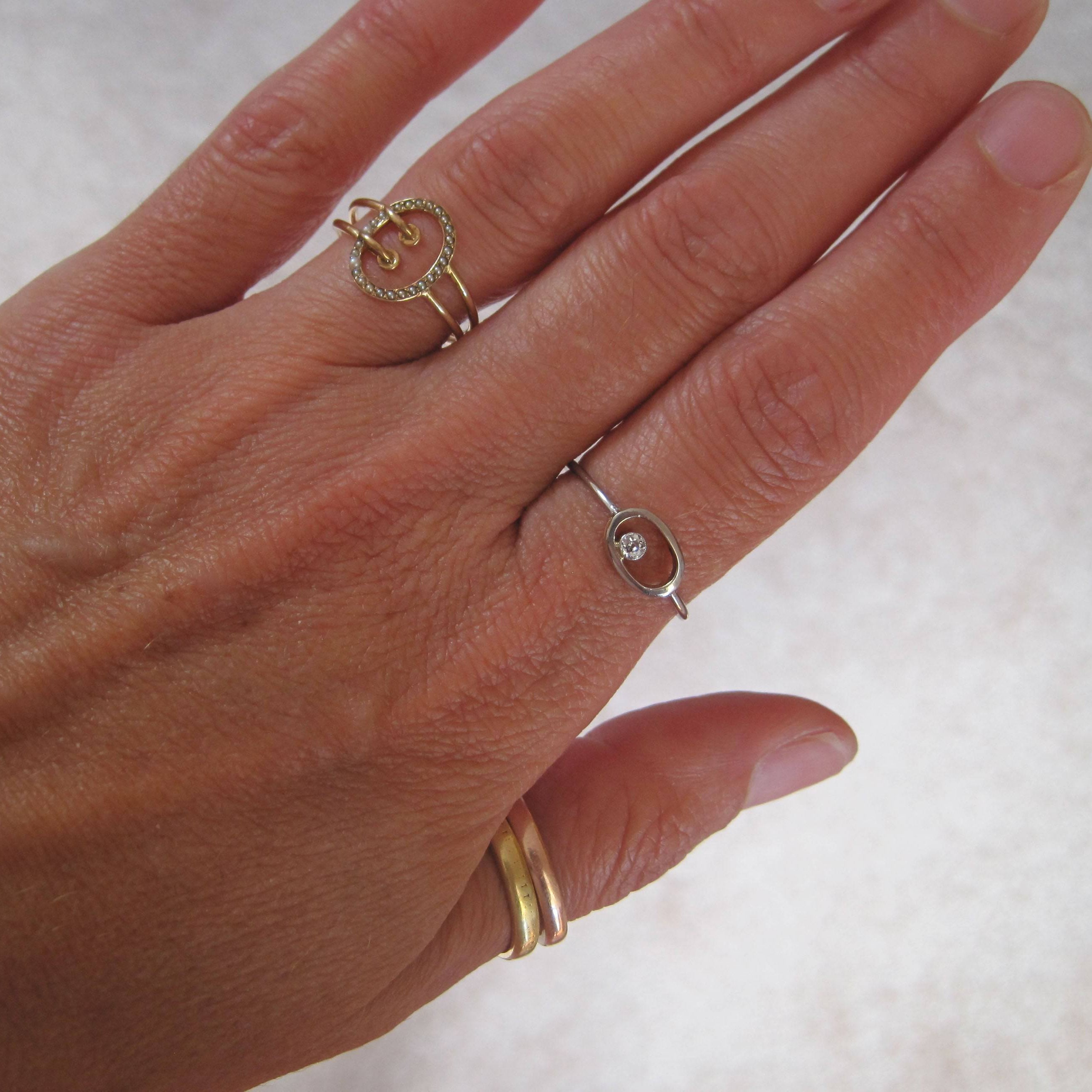 Platinum Arts & Crafts Diamond Ring by The Vintage Vault featuring a detailed design and sparkling diamond centerpiece.