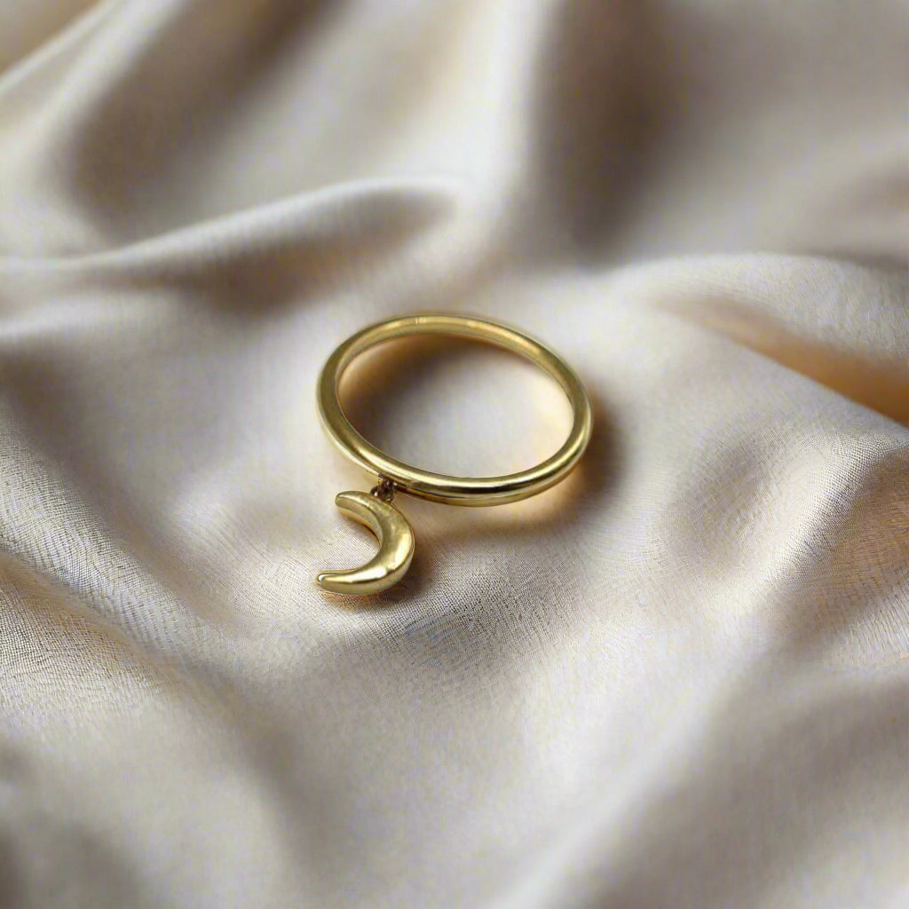 14k solid gold witchy crescent moon charm ring by Petra Star, featuring intricate moon design on a polished gold band.