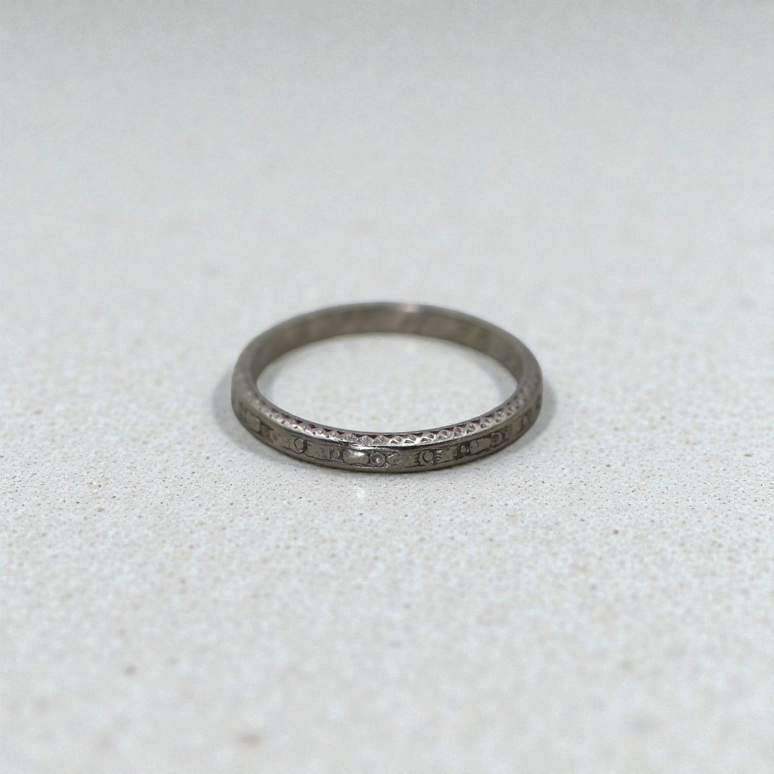Art Deco platinum band with cherry blossom design, engraved date 11.28.23, size 6, by The Vintage Vault.