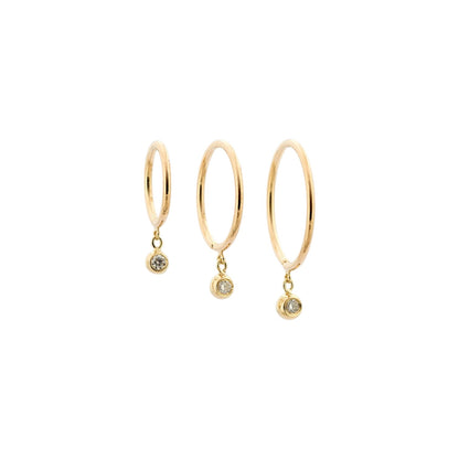 Diamond Droplet Huggie Earrings in 14k Yellow Gold