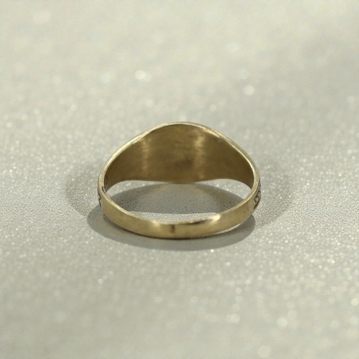 Edwardian Ostby & Barton pinky signet ring in 10k yellow gold, vintage jewelry with engraved design, worn on pinky finger