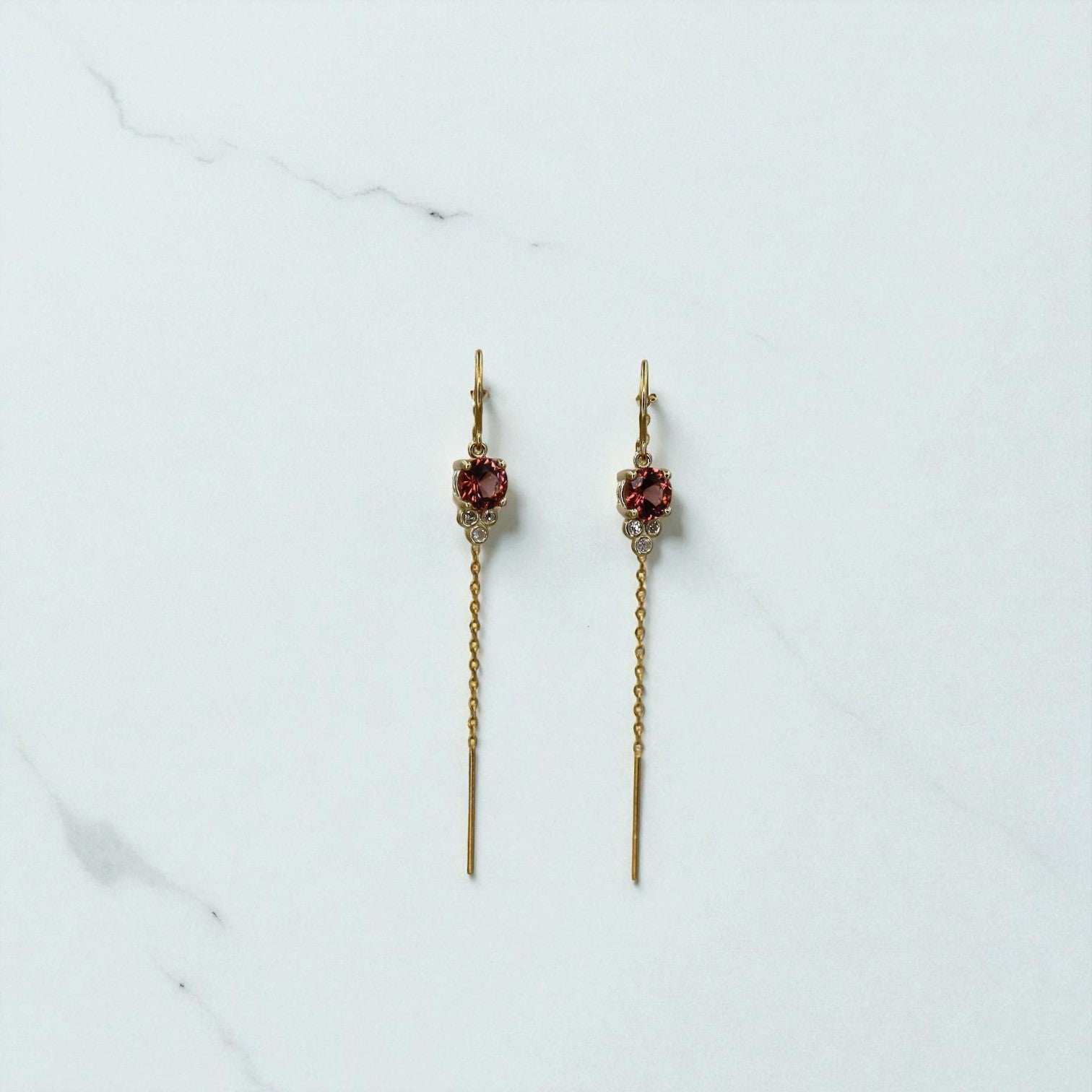 Malayan garnet threader earrings in 14k gold featuring delicate garnet stones and sleek, minimalist design.