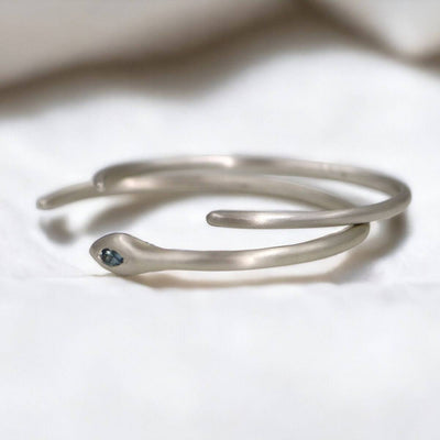 Handmade silver cuff bracelet featuring a vibrant Montana blue sapphire from dan-yell, stylish and elegant jewelry accessory.