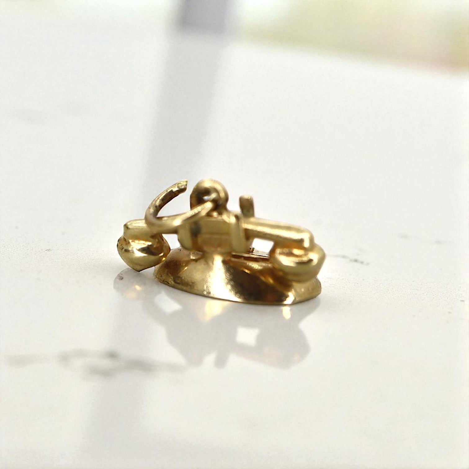 14k gold "I Love You" rotary telephone charm, vintage-inspired jewelry piece, featuring intricate design and detailed craftsmanship.