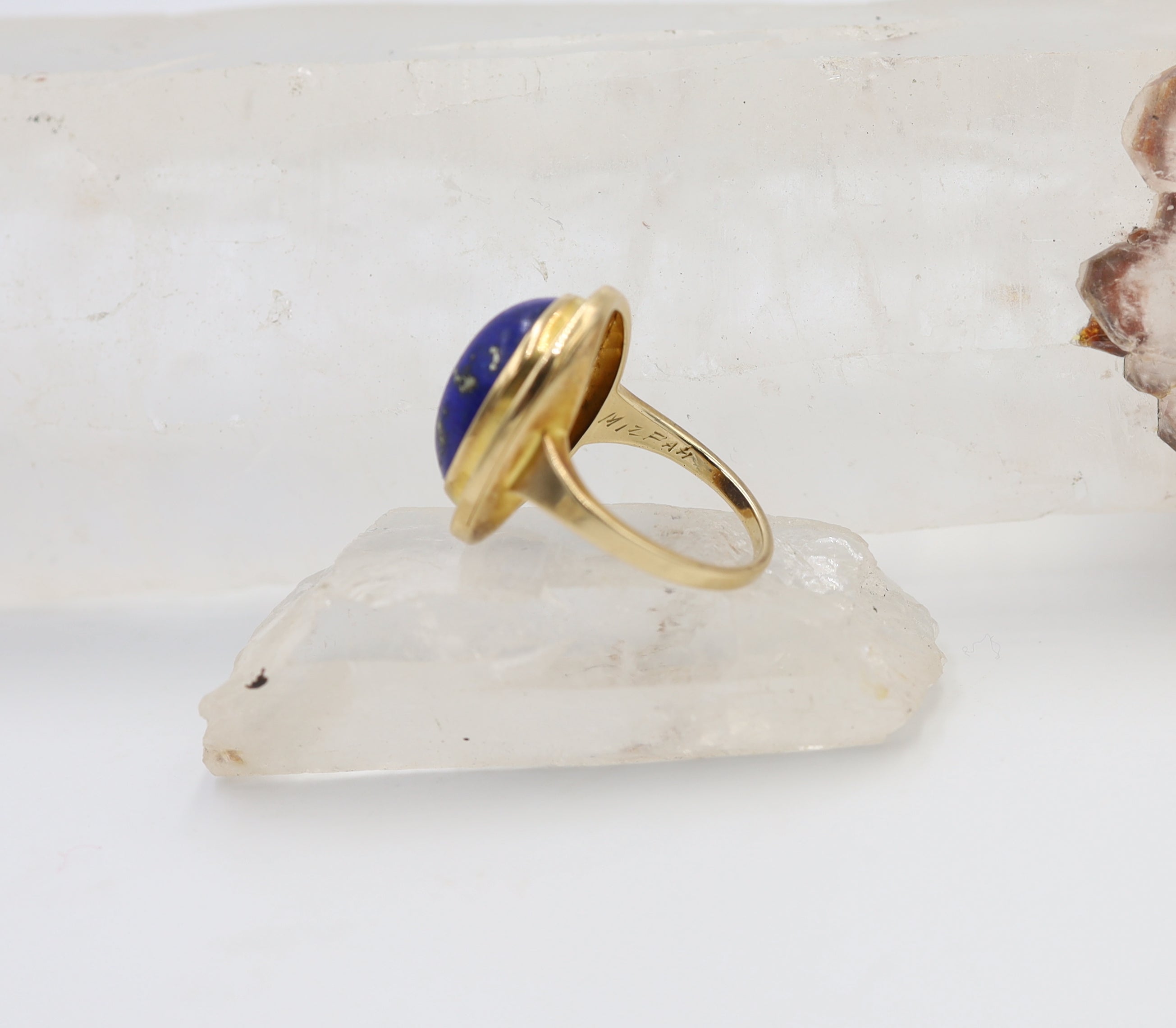 Antique lapis Mizpah ring with intricate silver band, featuring a central lapis gemstone and vintage design details.