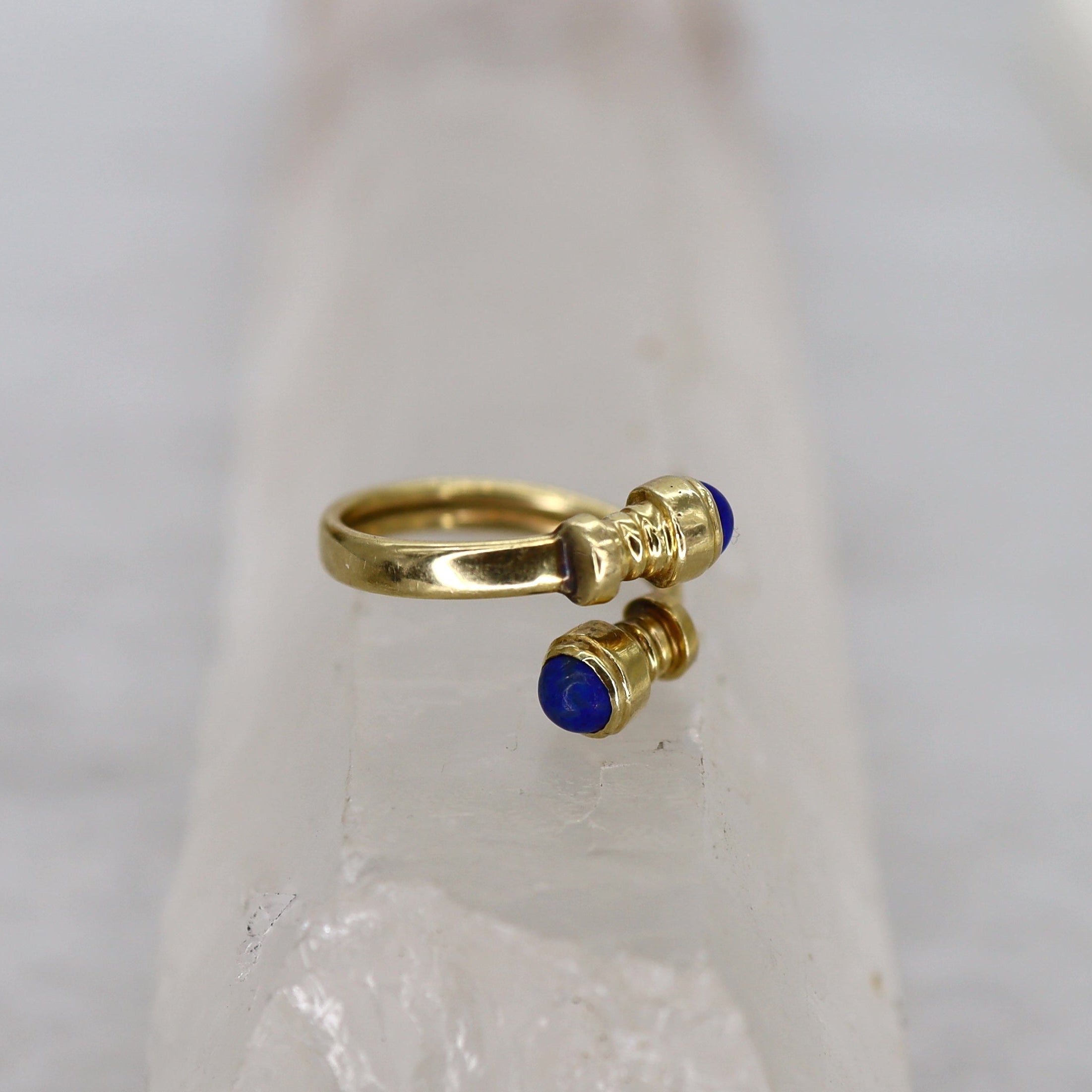 Vintage Lapis Bypass Ring in 14k yellow gold featuring a vibrant lapis gemstone and elegant bypass design.