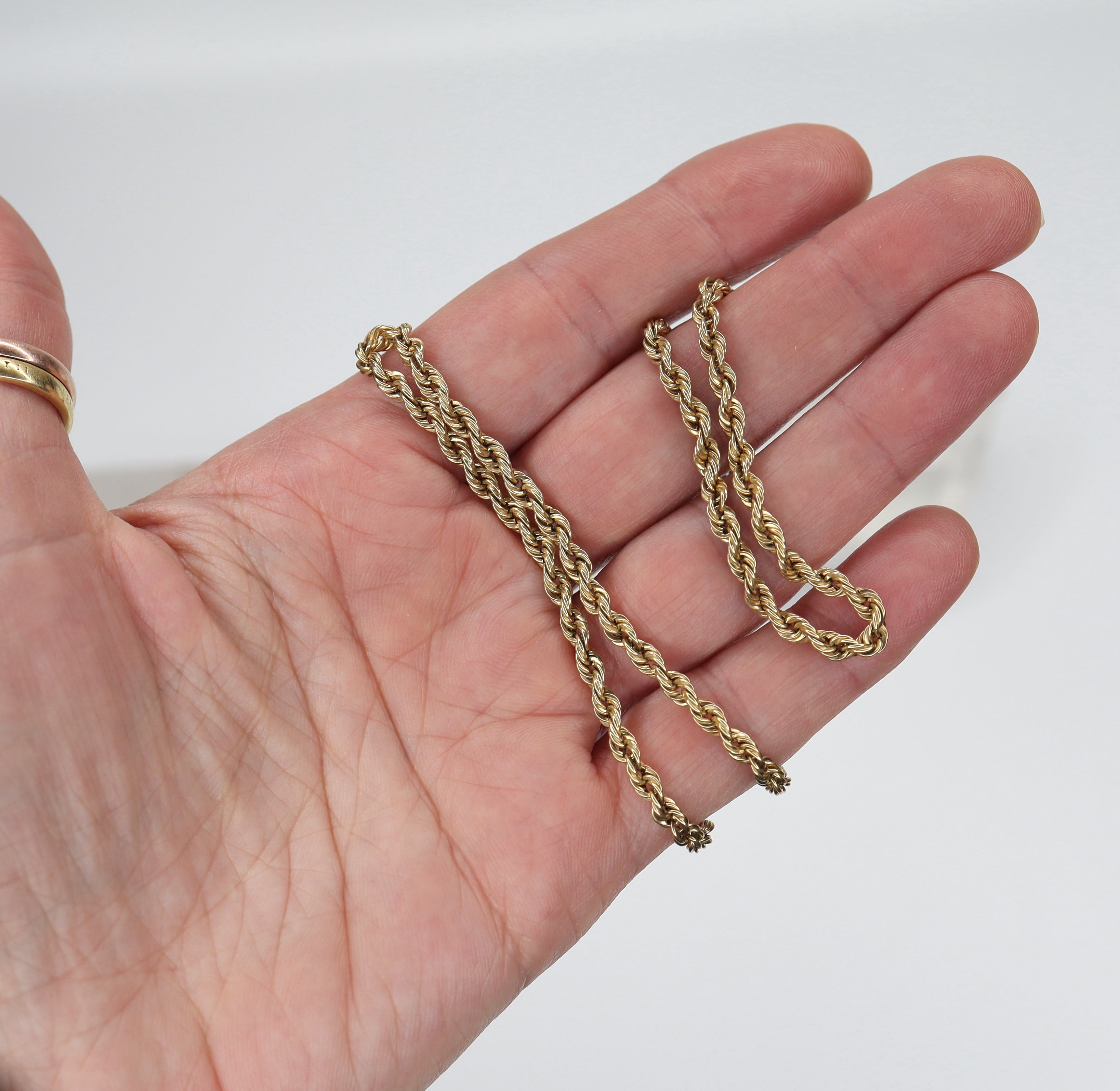 14k yellow gold heavy rope chain, 3.3 mm wide, 18.5 inches long, from The Vintage Vault, showing the textured twisted design.