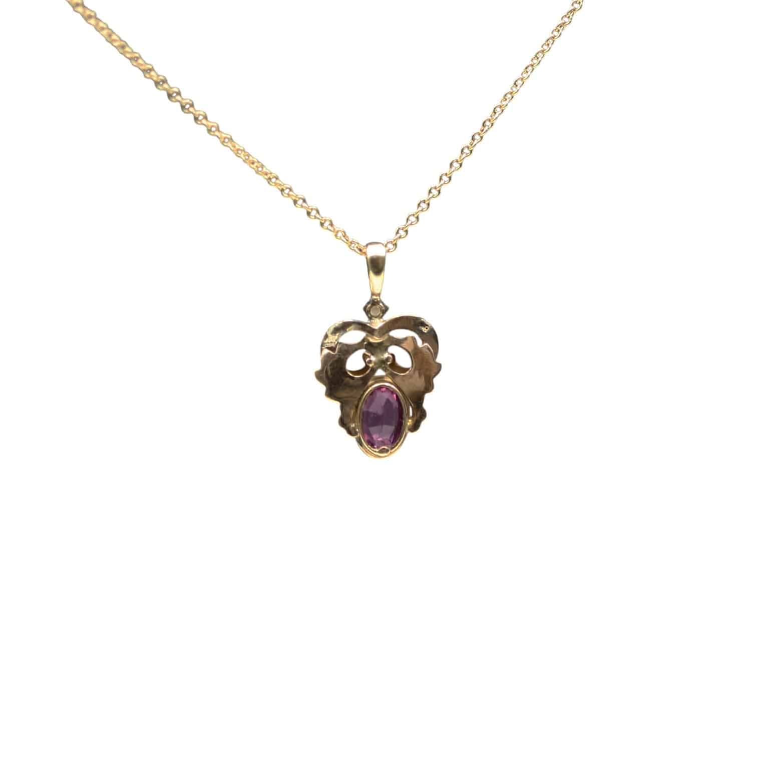 Antique Art Nouveau pink sapphire and enamel charm pendant featuring intricate design, crafted by The Vintage Vault.