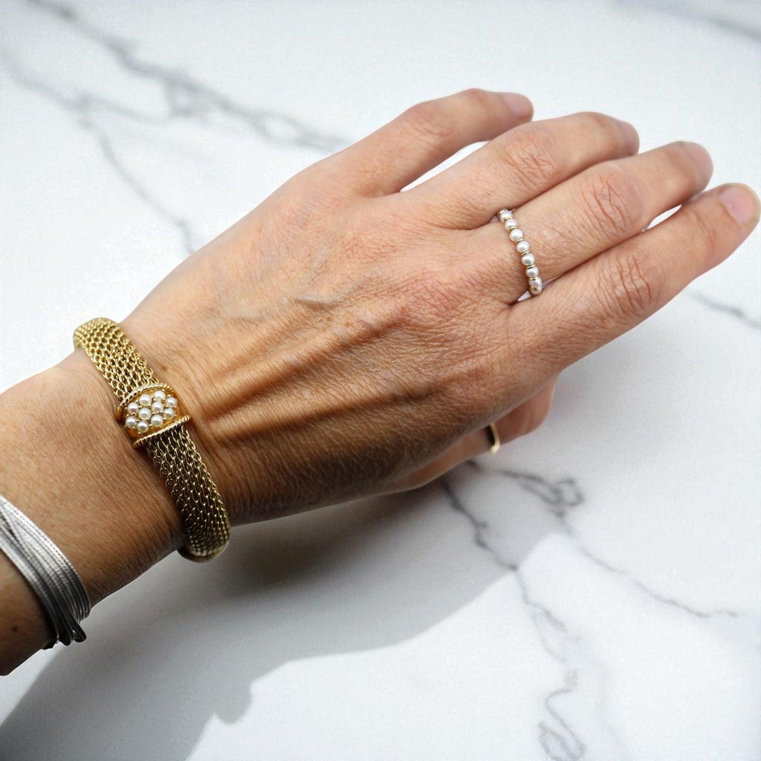 Vintage 14k gold mesh weave bracelet from The Vintage Vault, showcasing a sleek, intricate jewelry design.