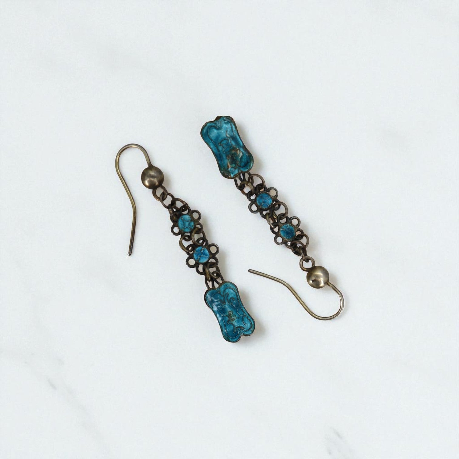 Art Nouveau Guilloche enamel earrings featuring intricate patterns and vibrant colors, crafted by The Vintage Vault.
