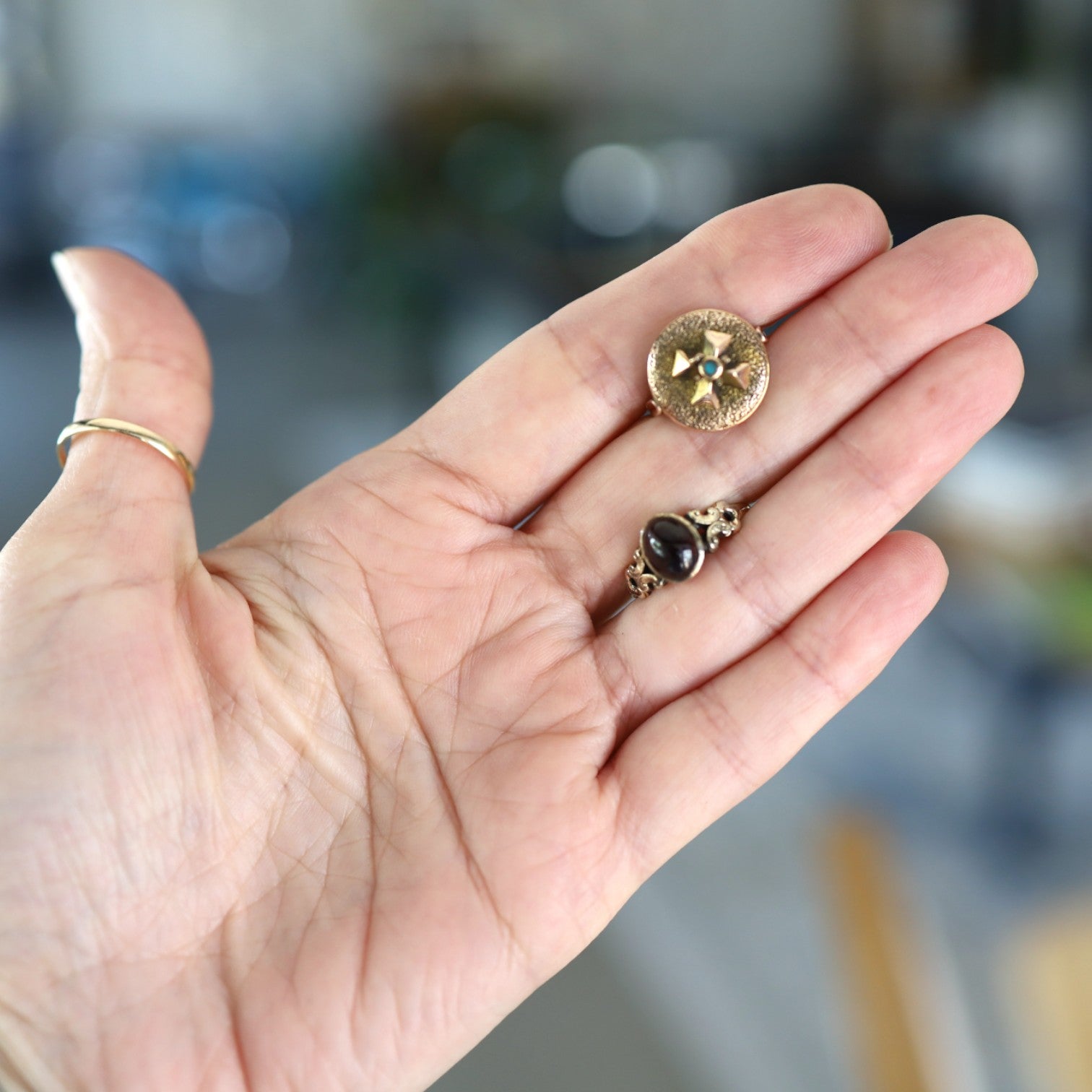 Victorian garnet ring with ornate gold band from The Vintage Vault, featuring a deep red garnet gemstone and vintage design.