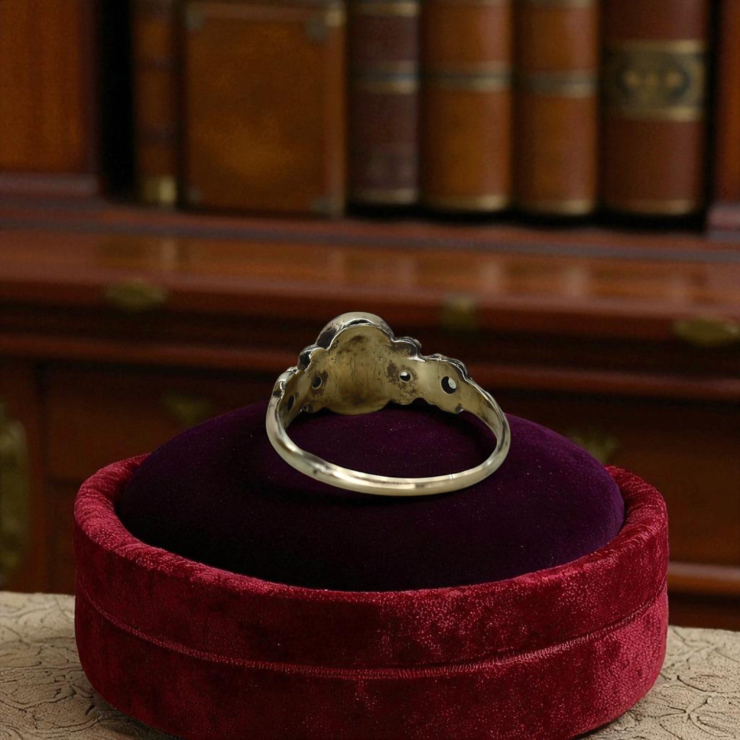 Victorian garnet ring with intricate gold band, vintage style jewelry from The Vintage Vault, featuring a deep red garnet gemstone.