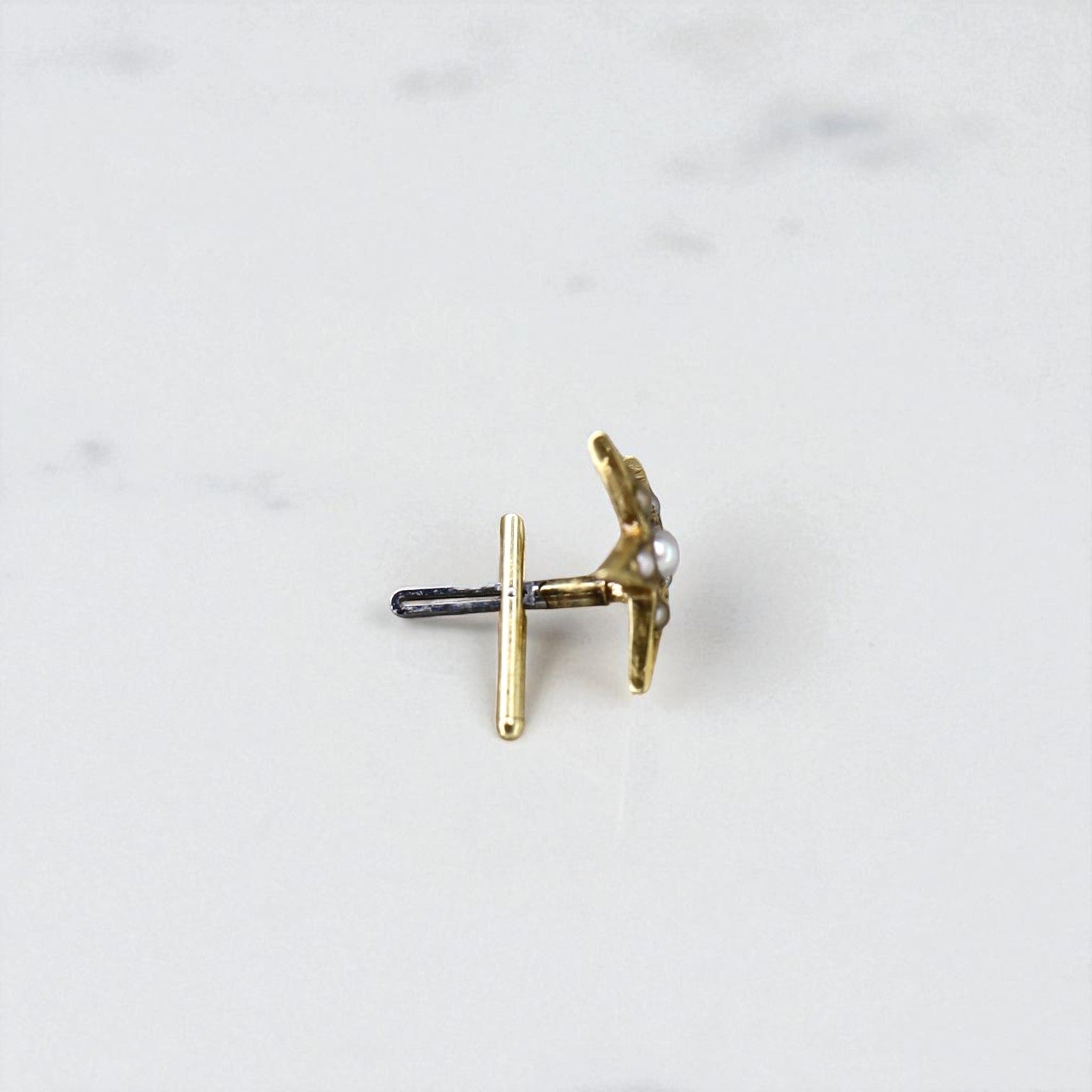 Single Victorian star earring with pearl accents in 14K gold from The Vintage Vault, showcasing a delicate and elegant stud design.