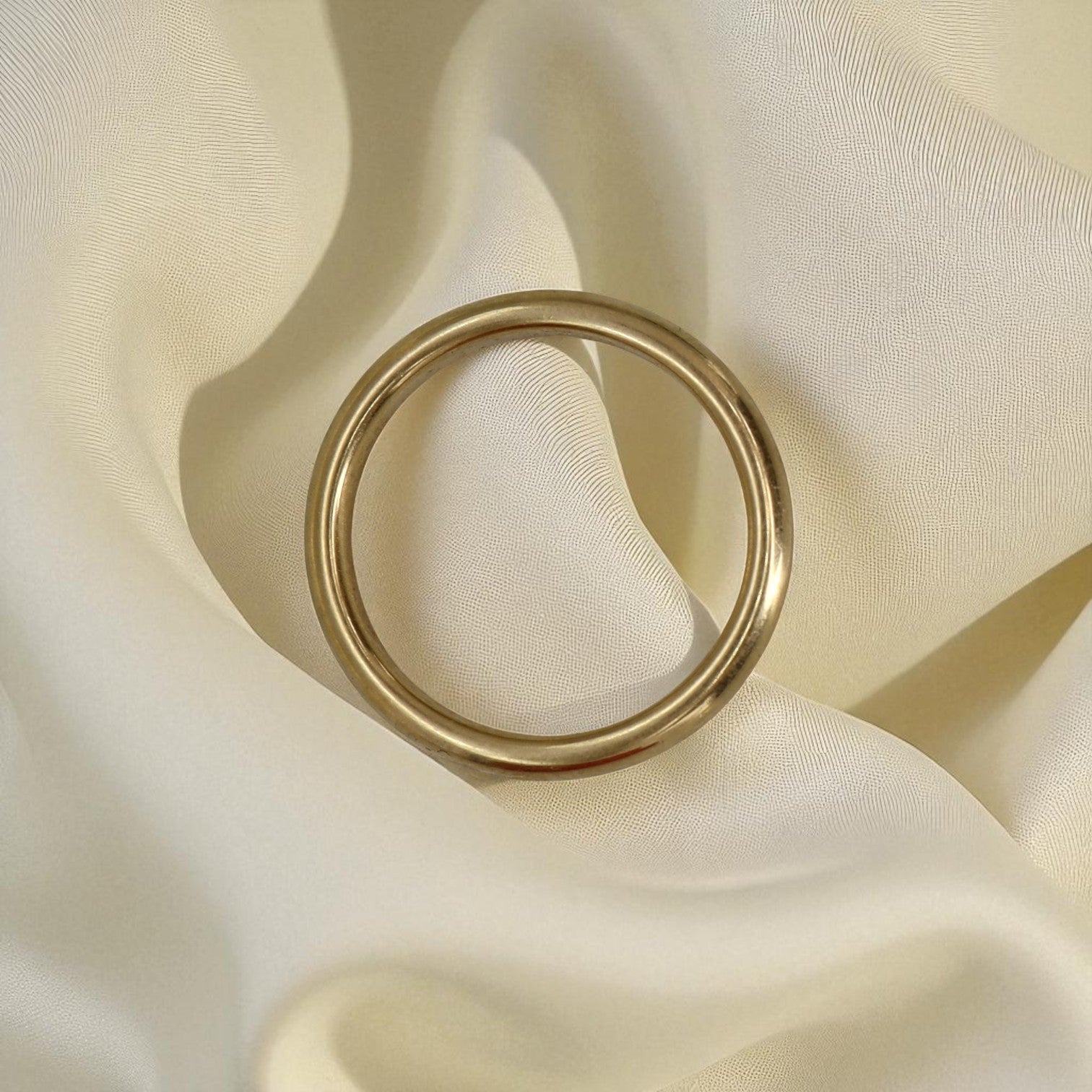 18k yellow gold band ring with a vintage-heavy tube style, 3mm wide, showcasing a smooth, buttery finish.