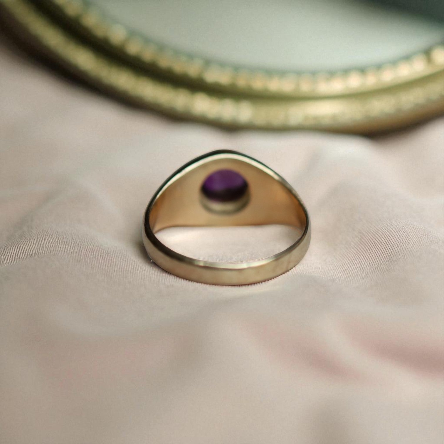 Vintage 1990s amethyst ring in 14k yellow gold with a bezel setting and tapered dome design, from The Vintage Vault.