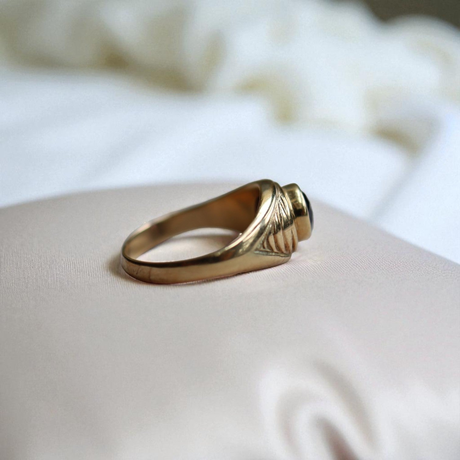 Vintage 1990s amethyst ring with bezel setting in heavy 14k yellow gold, featuring a tapered dome design.