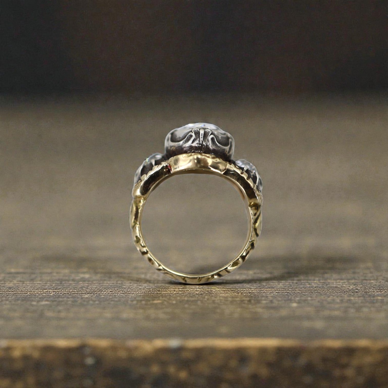 Georgian rose-cut diamond engagement ring with intricate vintage design, featuring a central rose-cut diamond and detailed metalwork.