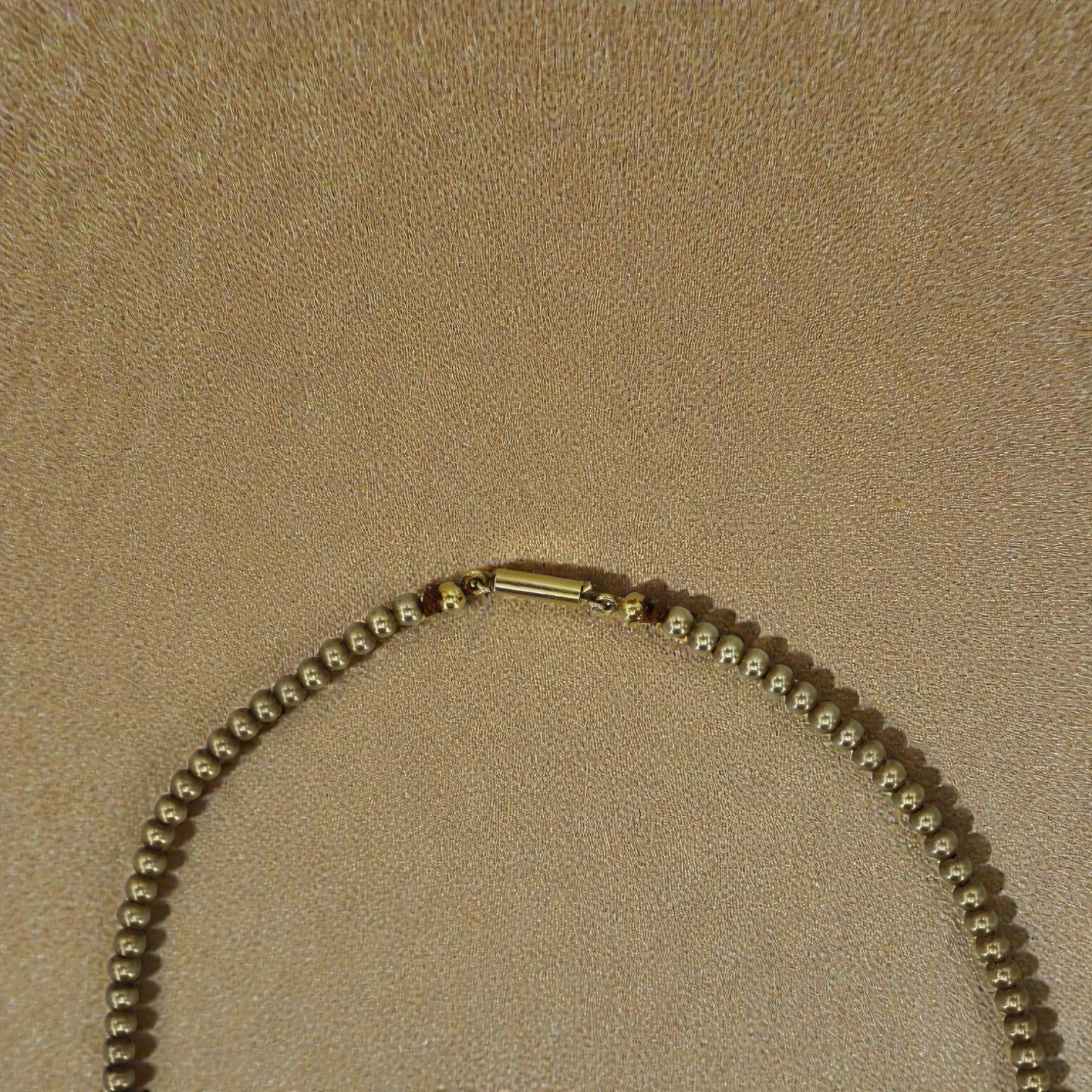 Antique gold-filled bead choker necklace with intricate detailing, featuring a vintage-inspired design on a delicate chain.