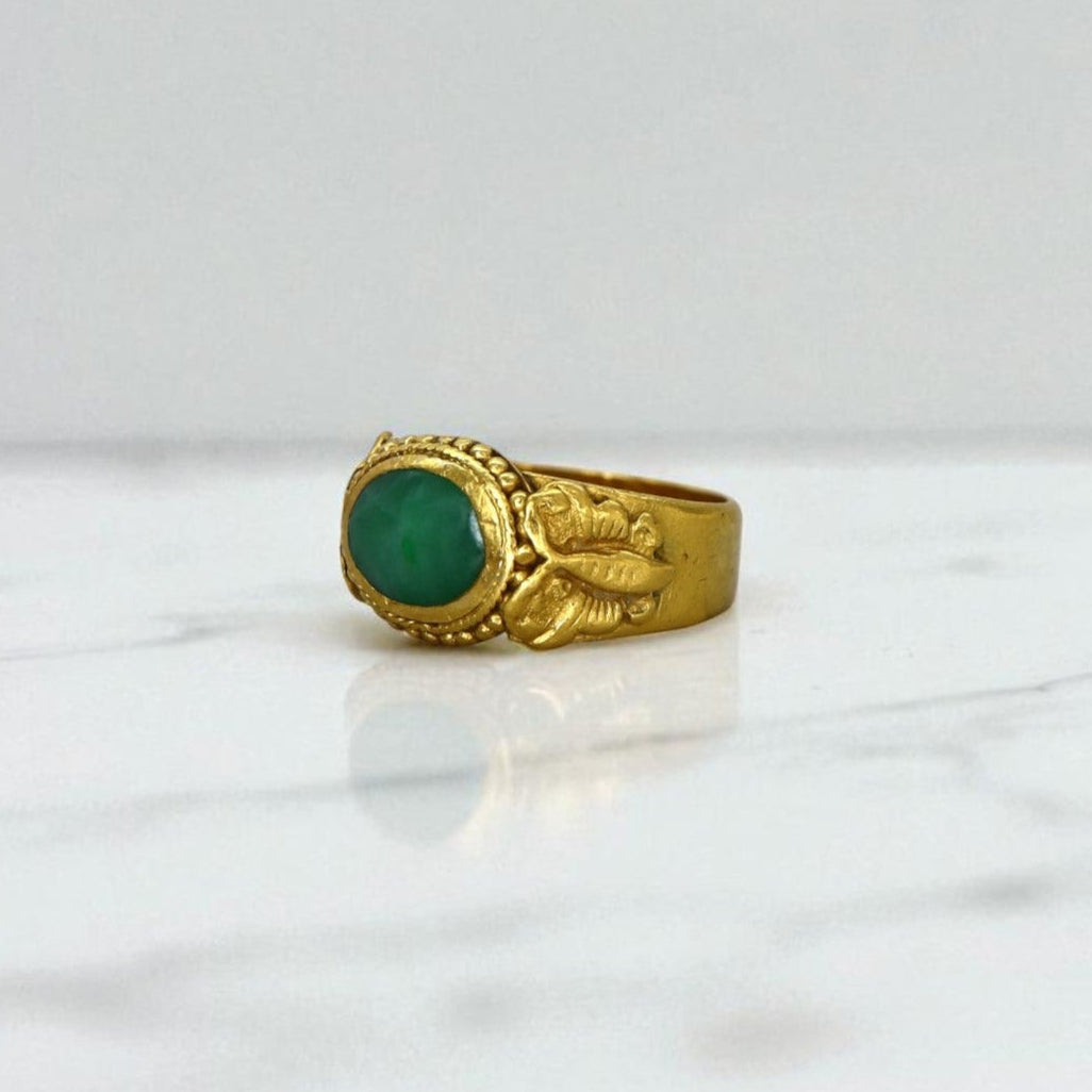 Art Nouveau Chinese jade saddle ring with butterfly design, 22K gold setting, showcasing intricate craftsmanship and vibrant green jade.