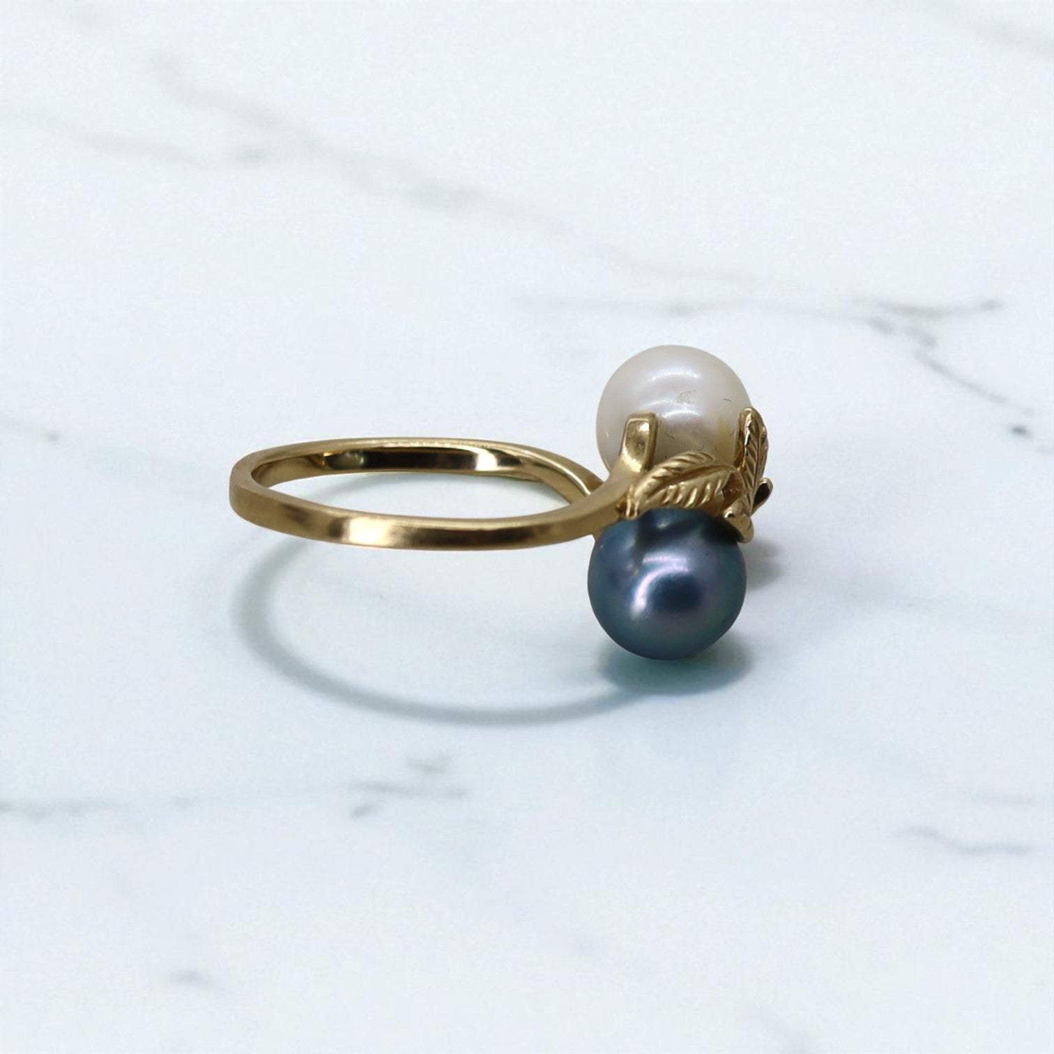 Vintage 14k gold leaf ring with black and white pearls, featuring a June birthstone design from The Vintage Vault.
