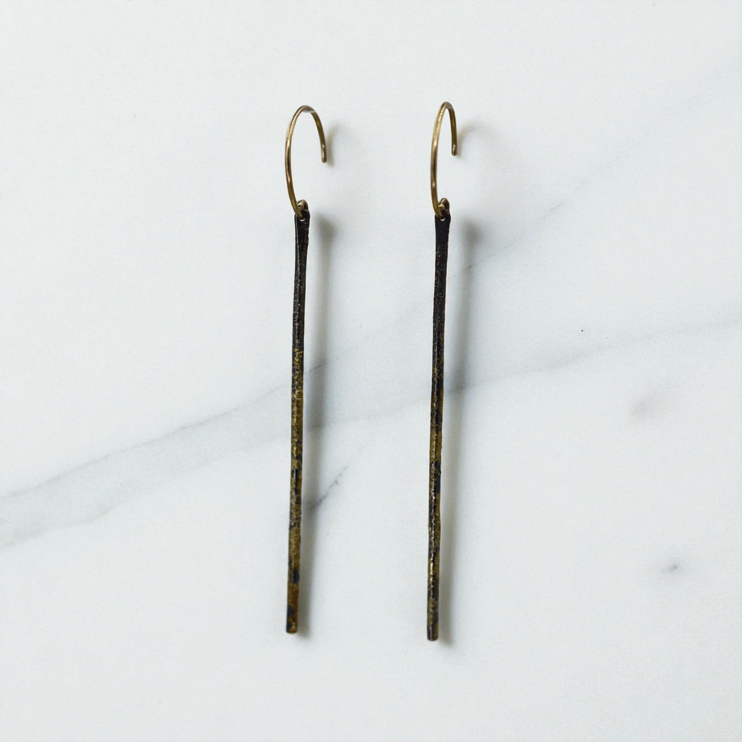 Kate Maller About Town earrings, mixed metal stick earrings with sleek, modern design, shown in the product image.