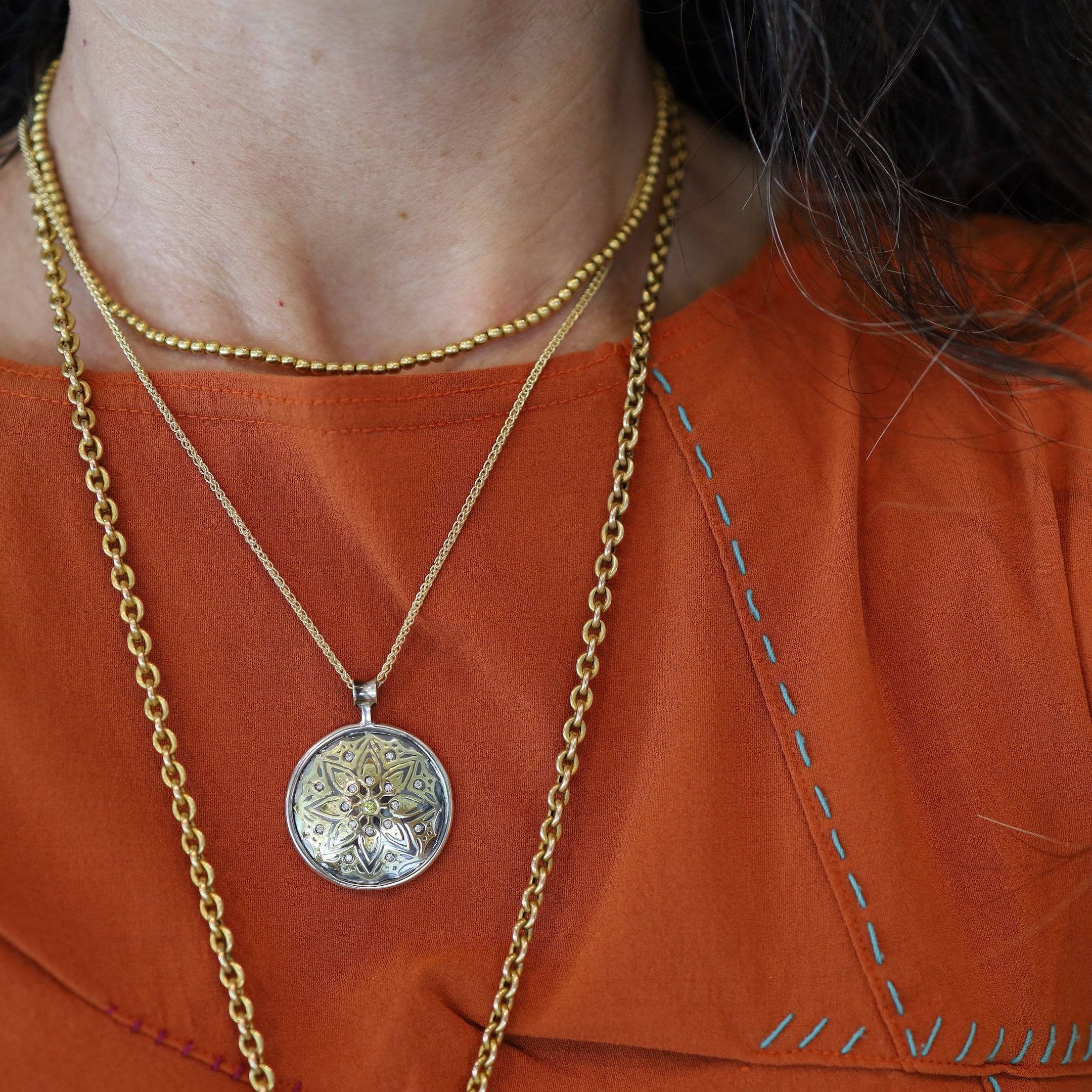 Andrew Zaruba Keum-Boo Celtic Knot Pendant featuring intricate silver Celtic knot design on a polished pendant.