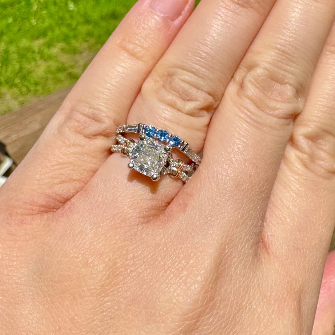 Close-up of Petra Star bespoke sapphire and diamond band ring showcasing sparkling gemstones and intricate design.