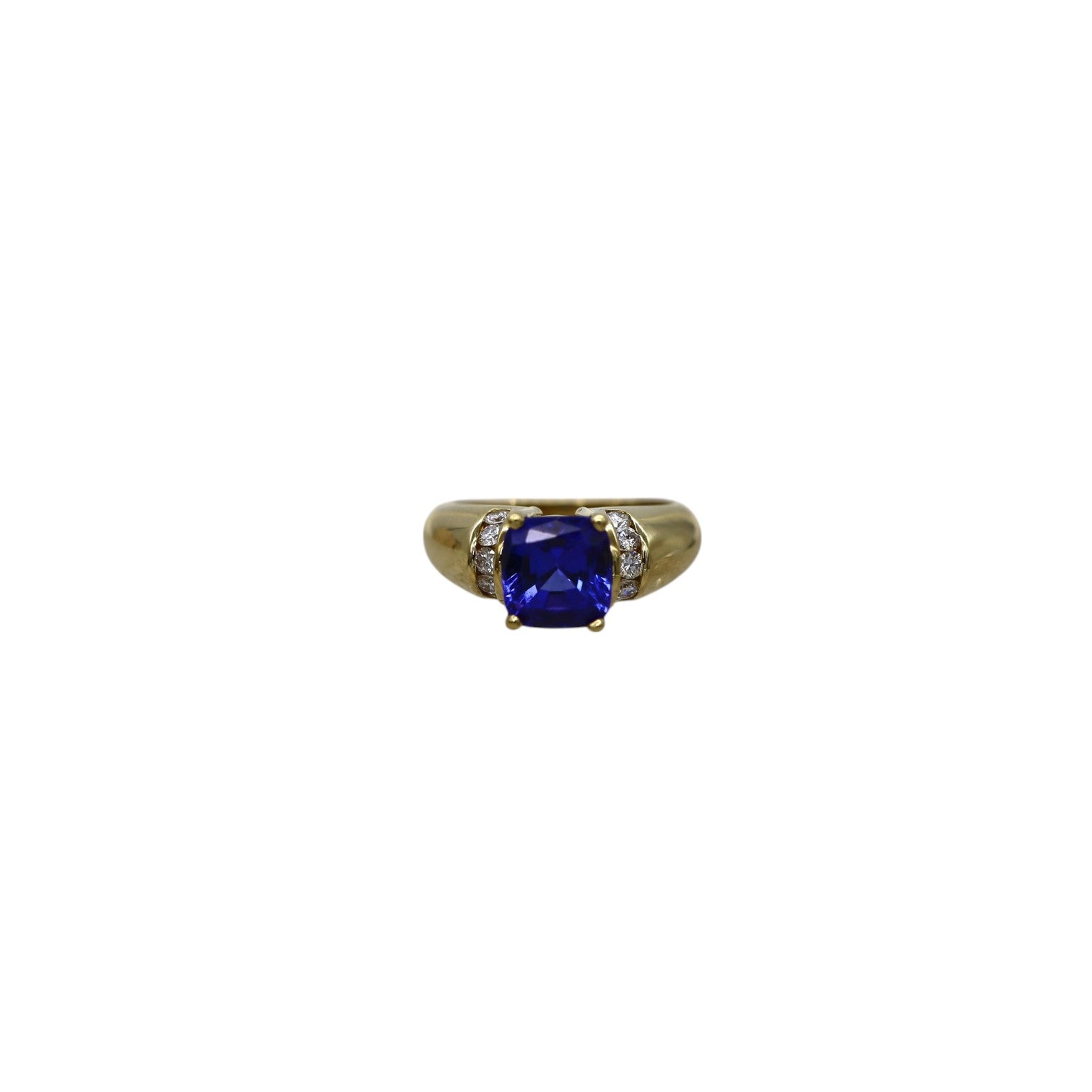Elegant Tanzanite and diamond ring featuring a vintage design, showcasing vibrant blue gemstone and sparkling accents.