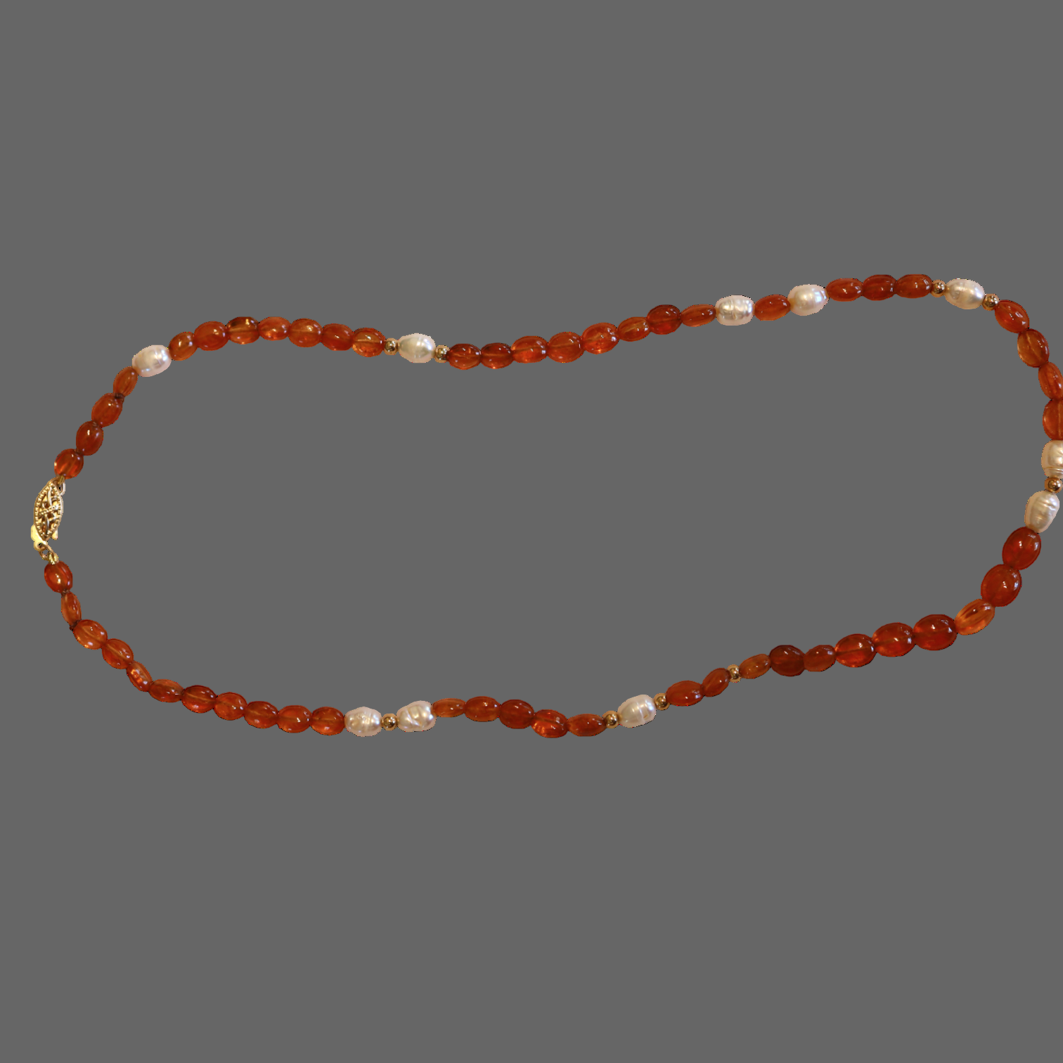 Freshwater pearl and Spessartite garnet necklace with 14k gold beads from Petra Star, featuring elegant pearl and vibrant garnet stones.