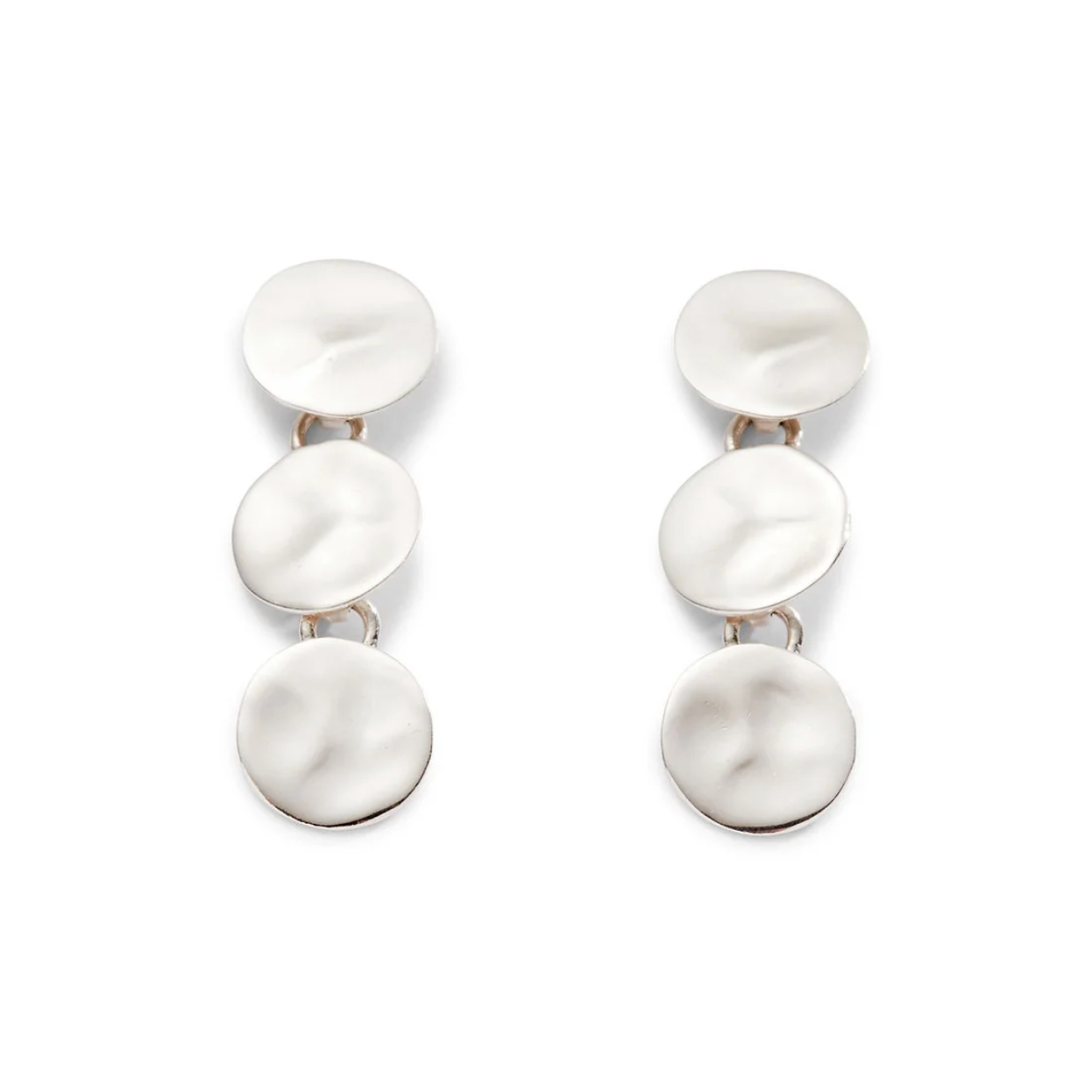 A pair of silver drop earrings featuring three vertically stacked, textured circular disc charms on a clean white background.