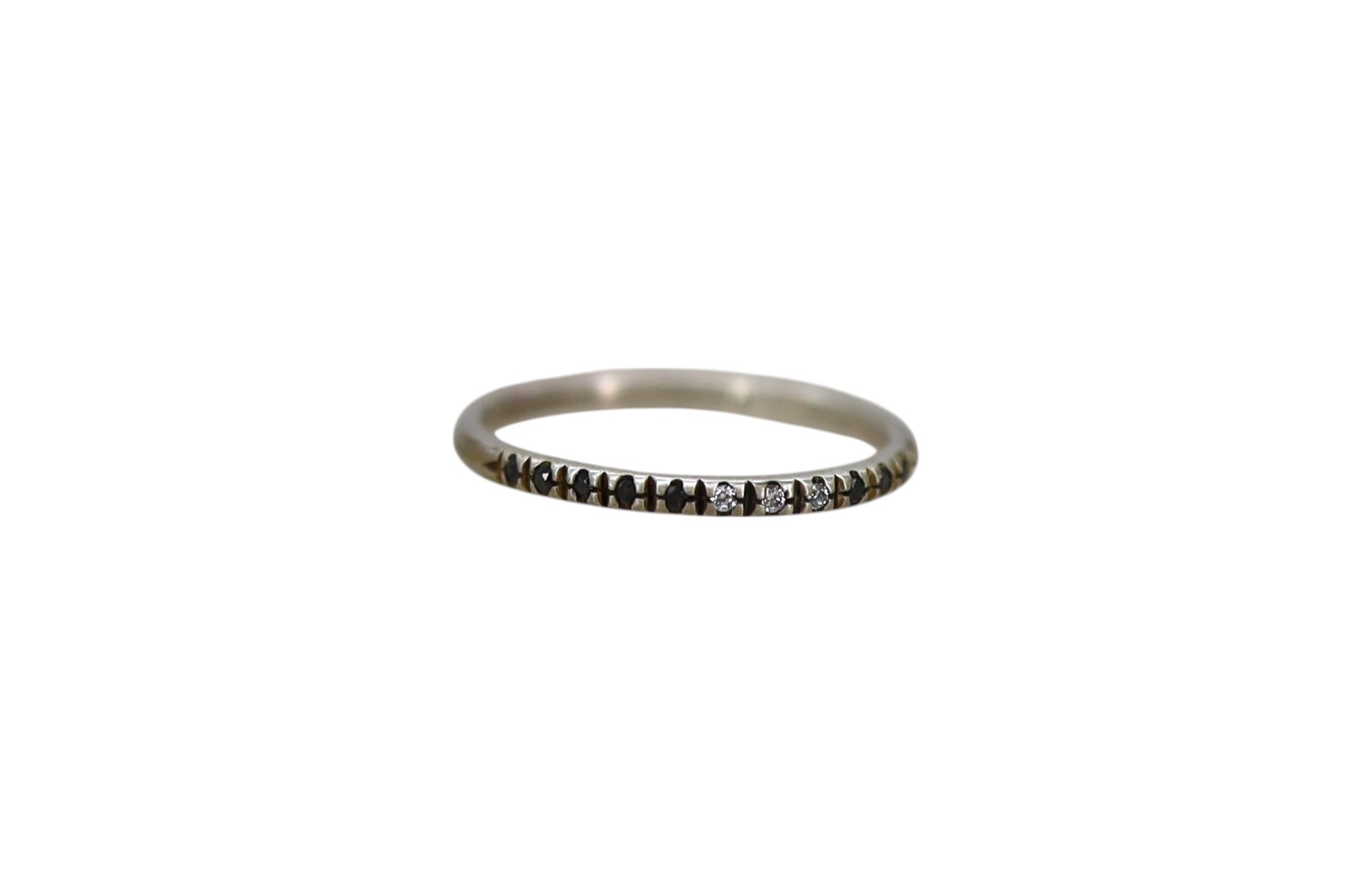Dan-yell trio ring featuring three interconnected bands in a sleek, modern design with polished metal finish.