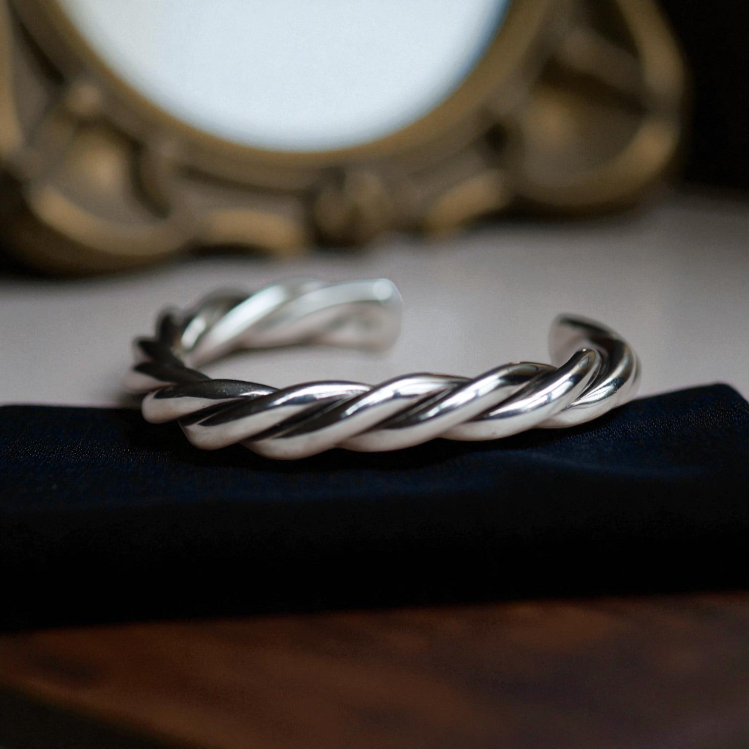 Vintage sterling silver twisted rope cuff bracelet with textured design, showcasing elegant craftsmanship and timeless style.